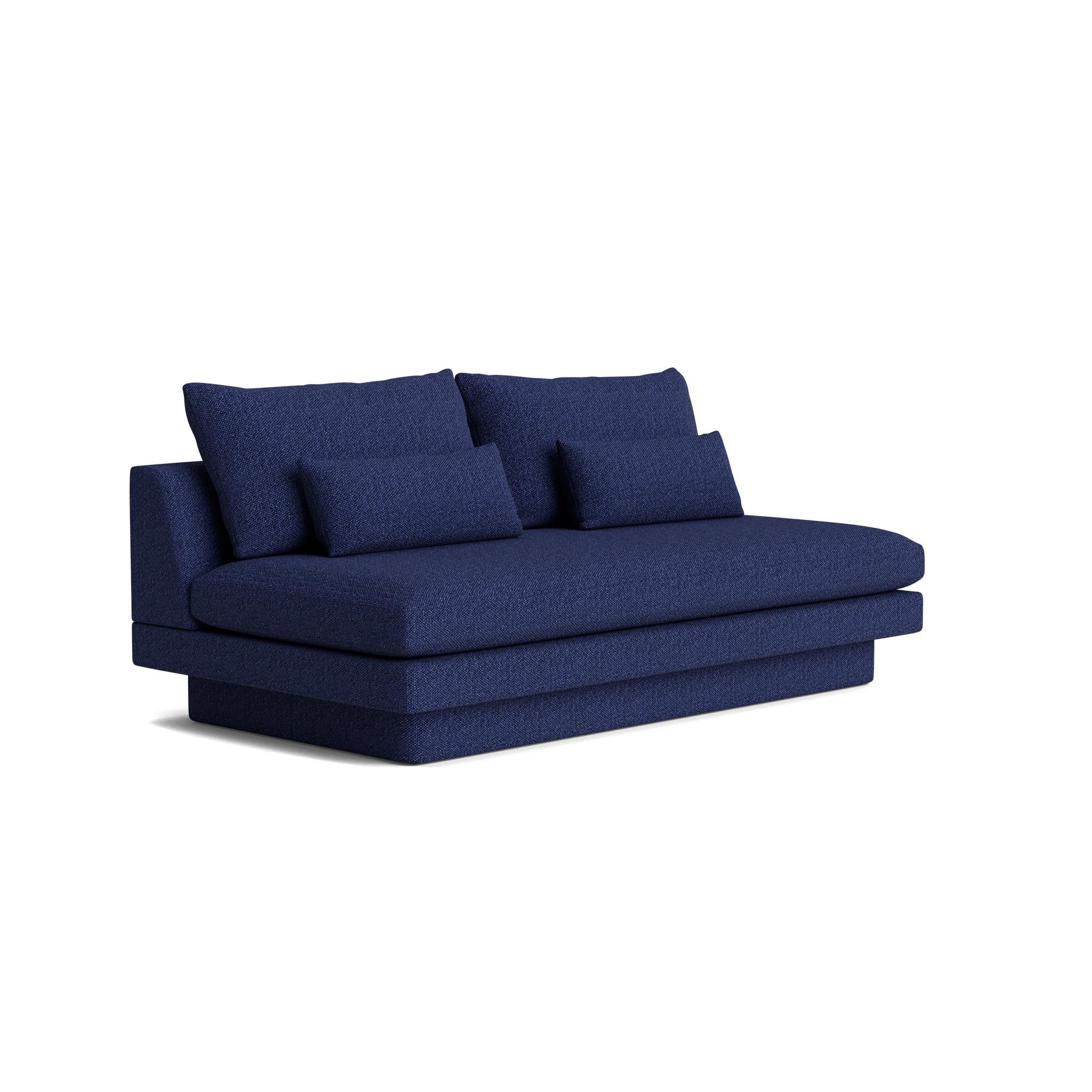 Our armless sofa features a deep bench seat, and split back cushions sit atop a plush upholstered plinth create a sleek, retro feel. Made in America, and endlessly customizable. Also available with steel legs.