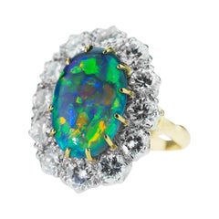 Retro Australian Black Opal and Diamond Cluster Ring in 18 Karat Gold