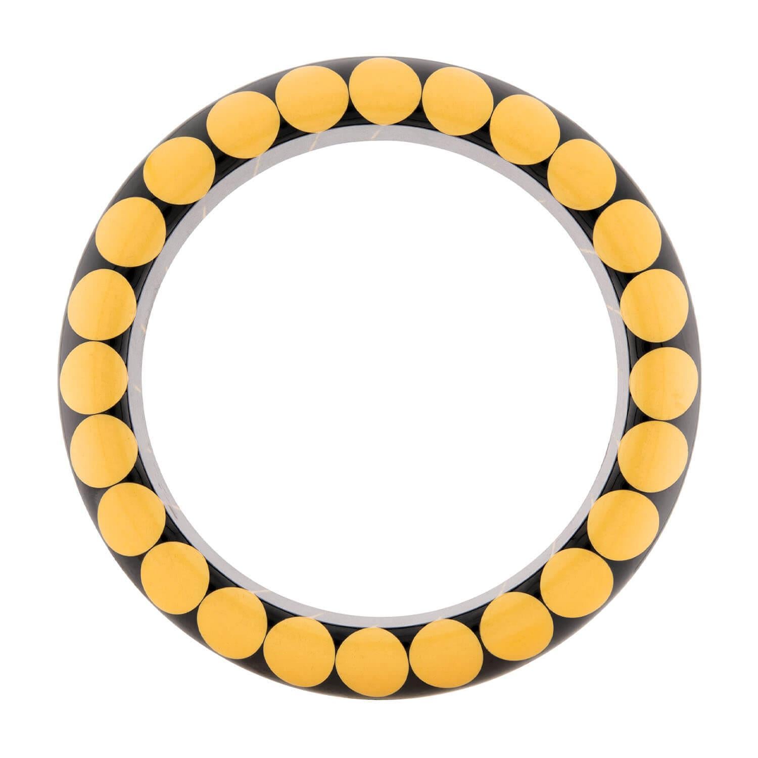 Bakelite is a resin material that was produced in the early 1900's and was the first plastic substance made of synthetic components. Initially used for its electrically non conductive and heat resistant properties in radio and telephone castings,