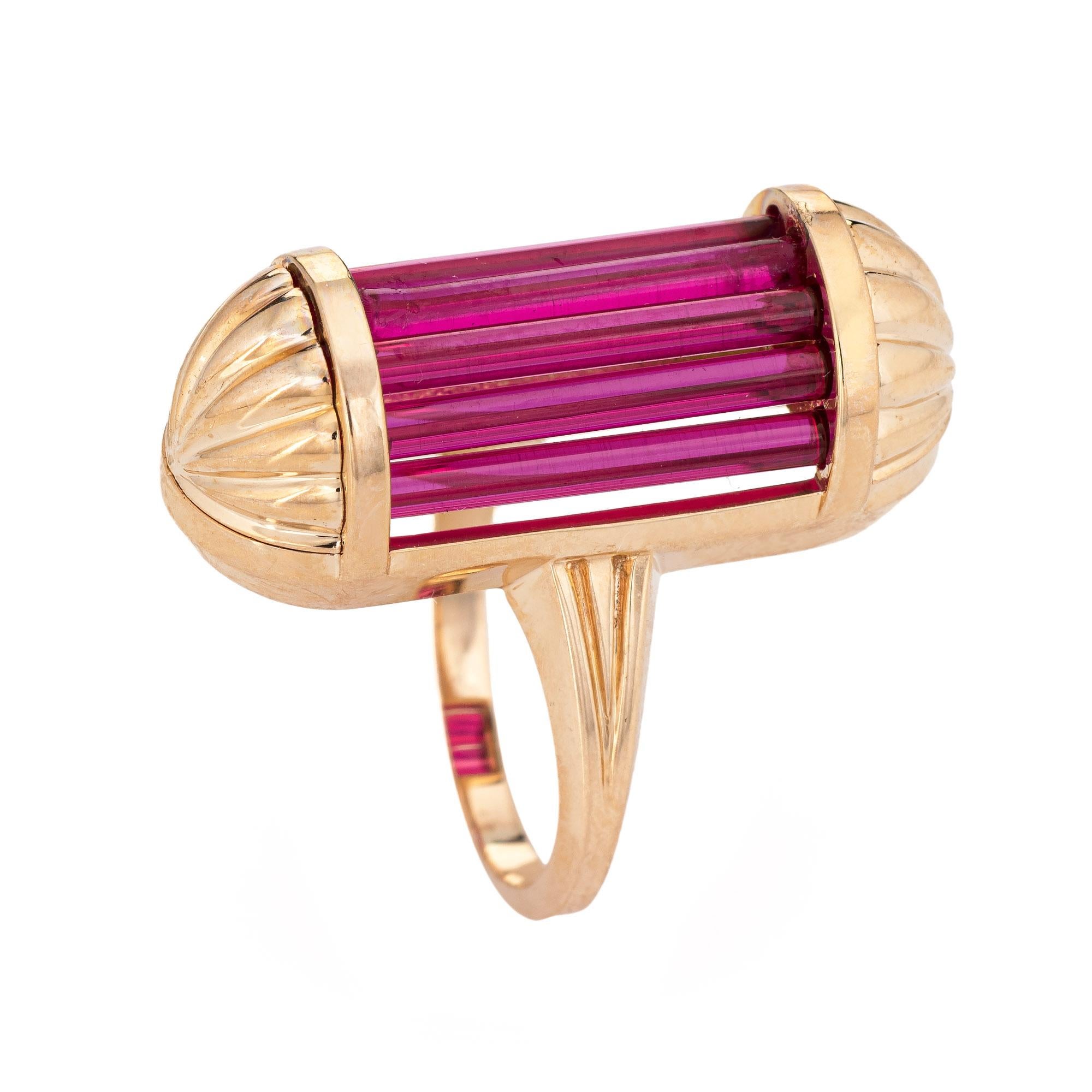 Stylish vintage barrel cocktail ring (circa 1940s to 1950s) crafted in 14 karat rose gold. 

Lab rubies measure 14mm x 2mm each (in excellent condition and free of cracks or chips). 

The unique ring features lab created rich red rubies set flush