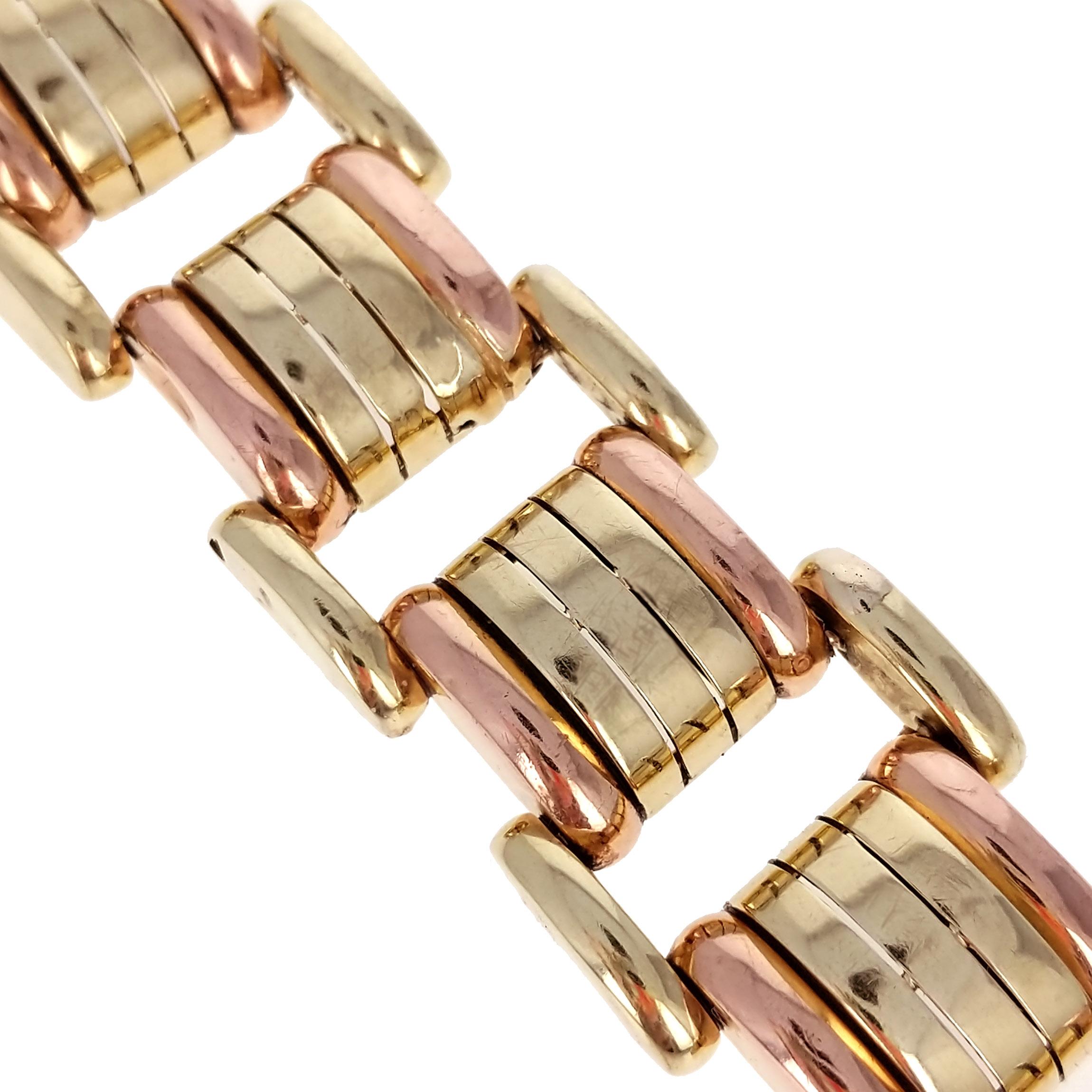 A Retro, 1940's, yellow and rose gold combination tank bracelet. 14k gold and hollow. With Yugoslavian marks for 14k gold. It is very easy to wear as an everyday item. There are minor dents that are seen in very close inspection. Please review