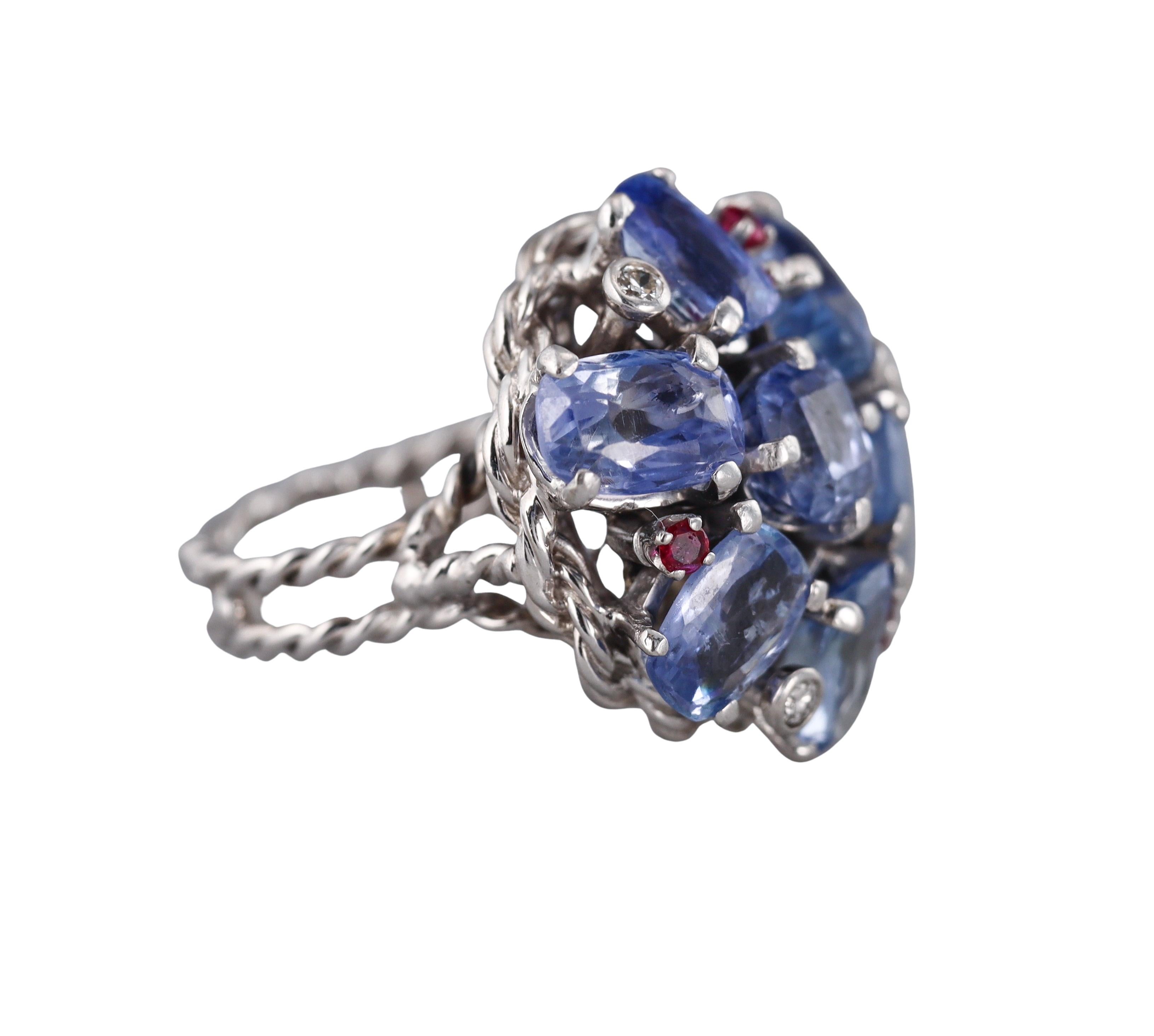 Retro 1950s 14k white gold cluster ring, set with approx. 0.09ctw H/SI1 diamonds, rubies and blue sapphires. 
Ring is a size 7, top measures 27mm x 27mm. 
Weight - 15.4 grams. 
Not marked - tested 14k. 