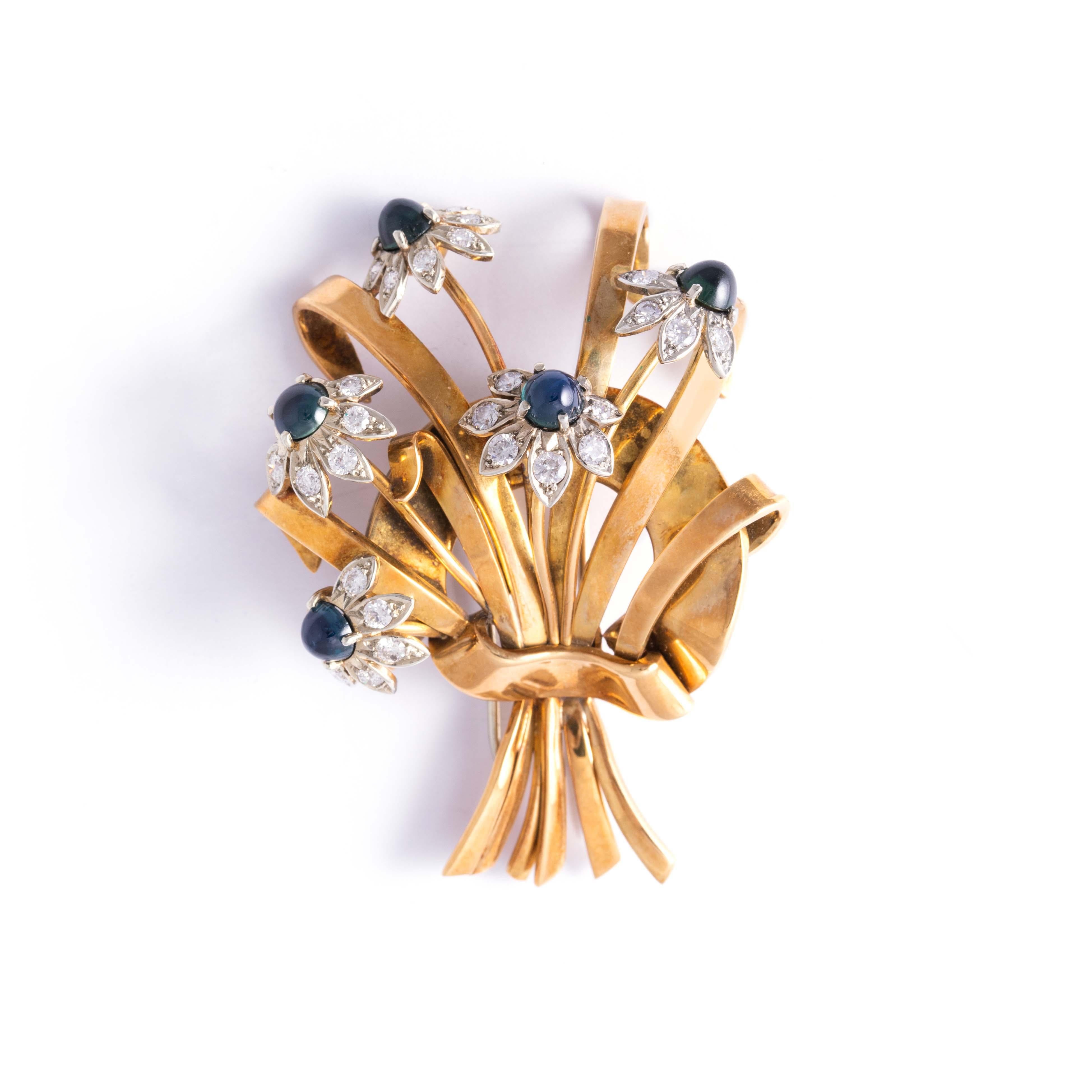 Retro Brooch 18K yellow and white gold brooch depicting a bouquet of flowers, set with round-cut diamonds and cabochon-cut sapphire (not tested).
Dimensions: 6.00 centimeters x 4.40 centimeters.
Gross weight: 28.23 grams.