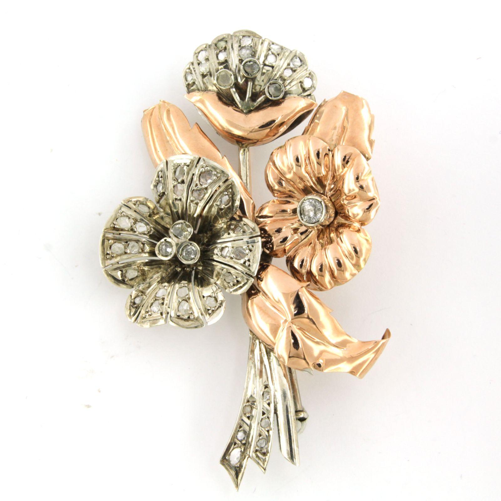 Retro brooch set with rose cut and old mine cut diamonds diamonds up to 1.00ct - G/H - SI/Pique - pink gold and silver - 5 cm x 7.5 cm

Detailed description

The brooch is 5.0 cm wide and 7.5 cm high

weight: 14.5 grams

Gold content below 14k,