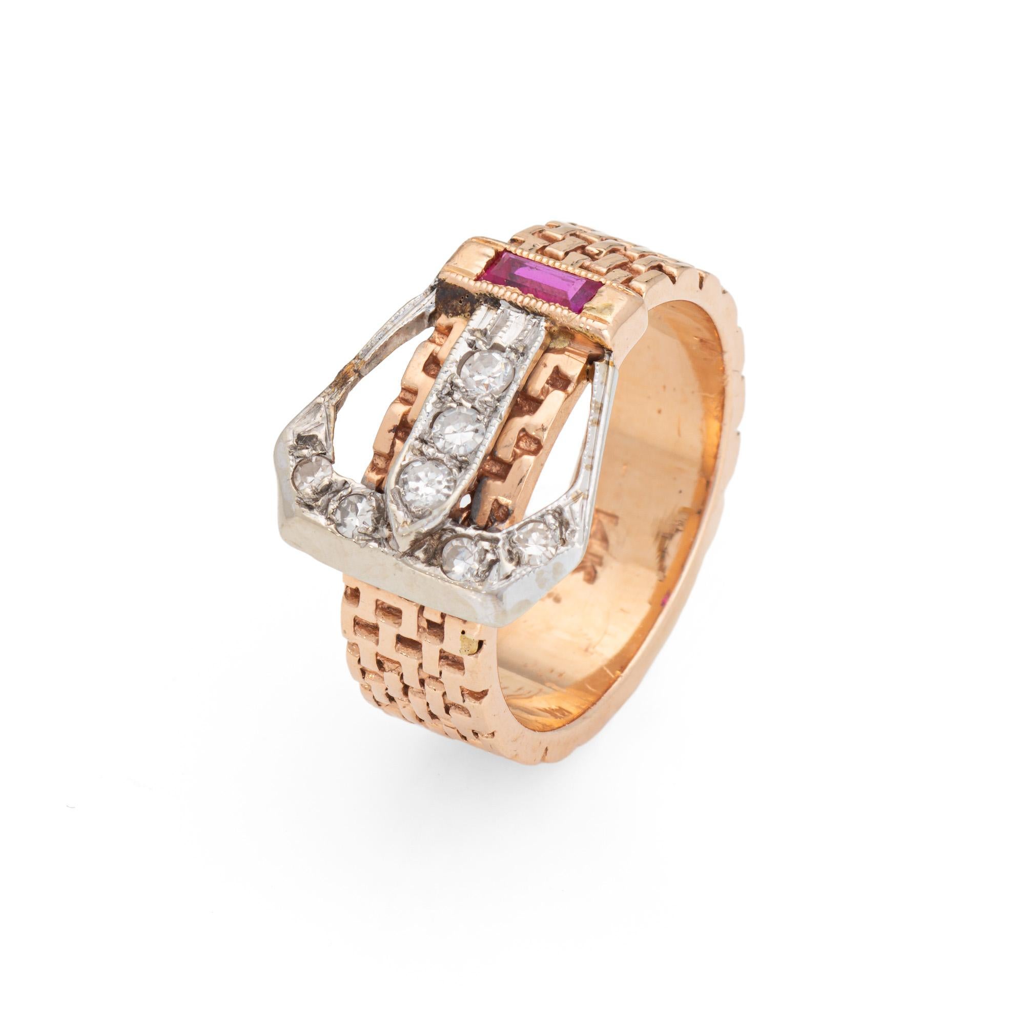 Stylish retro diamond buckle ring crafted in 14 karat rose gold (circa 1940s). 

7 single cut diamonds total an estimated 0.05 carats (estimated at I-J color and SI2-I2 clarity). One ruby (lab) measures 3.5mm x 1.5mm.   

The sweet buckle design
