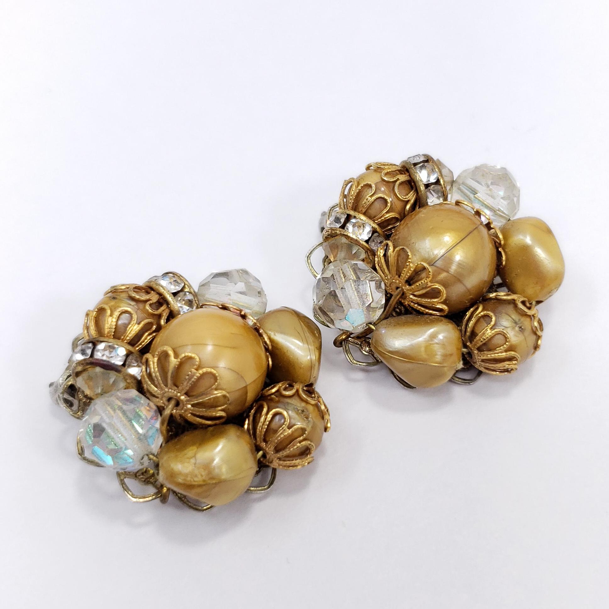 These stylish retro clip on earrings feature clusters of caramel beads and sparkling aurora borealis crystals. Silver and brass tone.