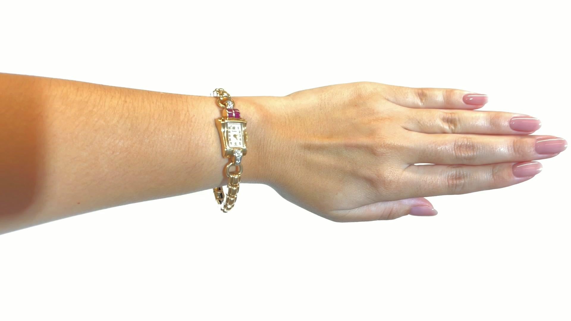 Retro Cartier Diamond Ruby Watch. Featuring 5 Old European Cut diamonds approximately 0.25 carat total, D-E color, VS clarity. With 4 square ruby highlights approximately 1.20 carat total. Serial #6549, hallmark for Blank & Co. Circa 1940s. 6 1/2
