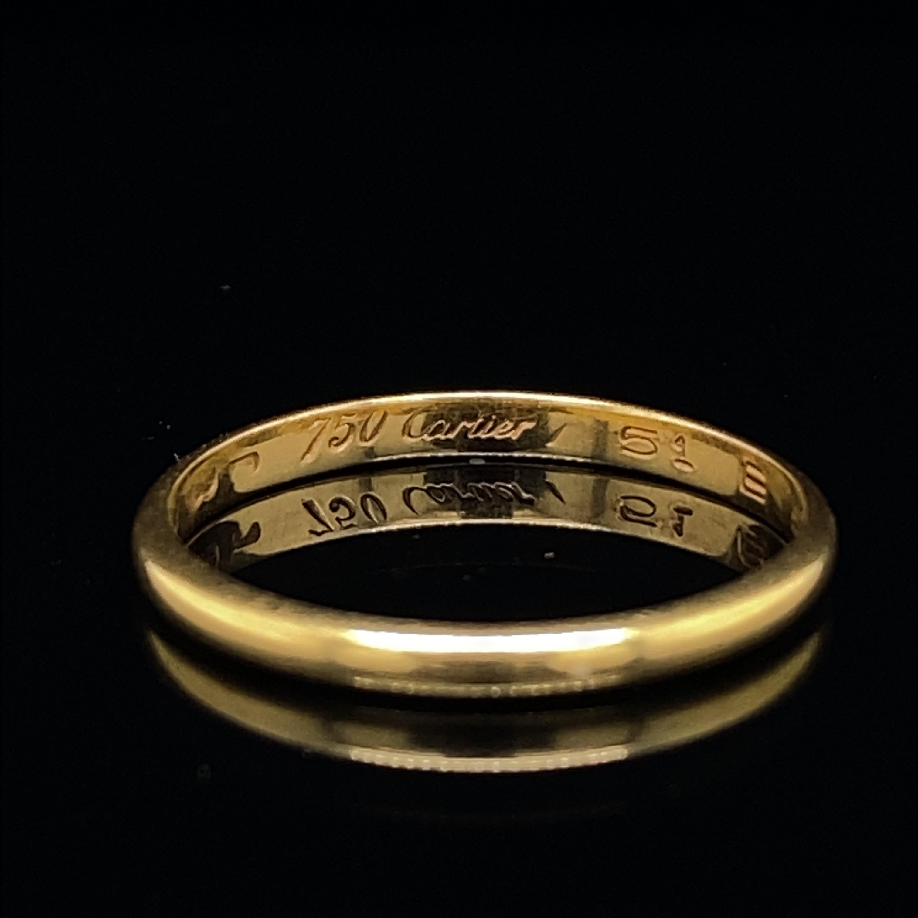 A retro Cartier wedding band 18 karat yellow gold, circa 1990.

This classic 'D' shaped comfort fit wedding band by Cartier has a smooth polished finish.

Signed 'Cartier', '750', '51' serial no. 135189 

Dimensions:
1.5mm width

Ring size: UK