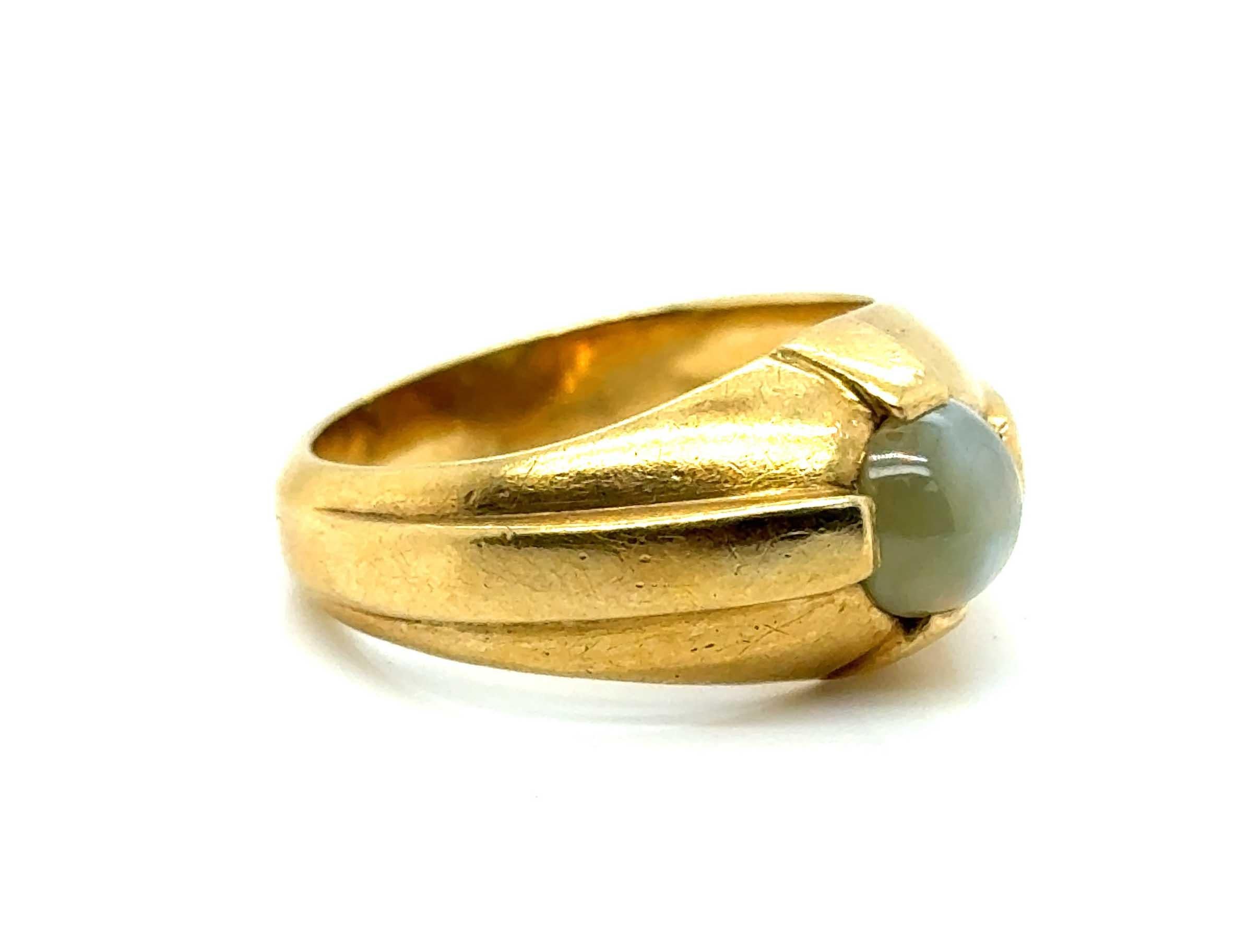 Genuine Original Antique from 1960's Retro Cat's Eye Mens Unisex Ring 18K Yellow Gold


Features a Genuine Natural 1ct Chrysoberyl Round Cabochon Cat's Eye Gemstone

Designed for a Man, Can Be Worn by a Man or Woman

Oversized Has Become Extremely