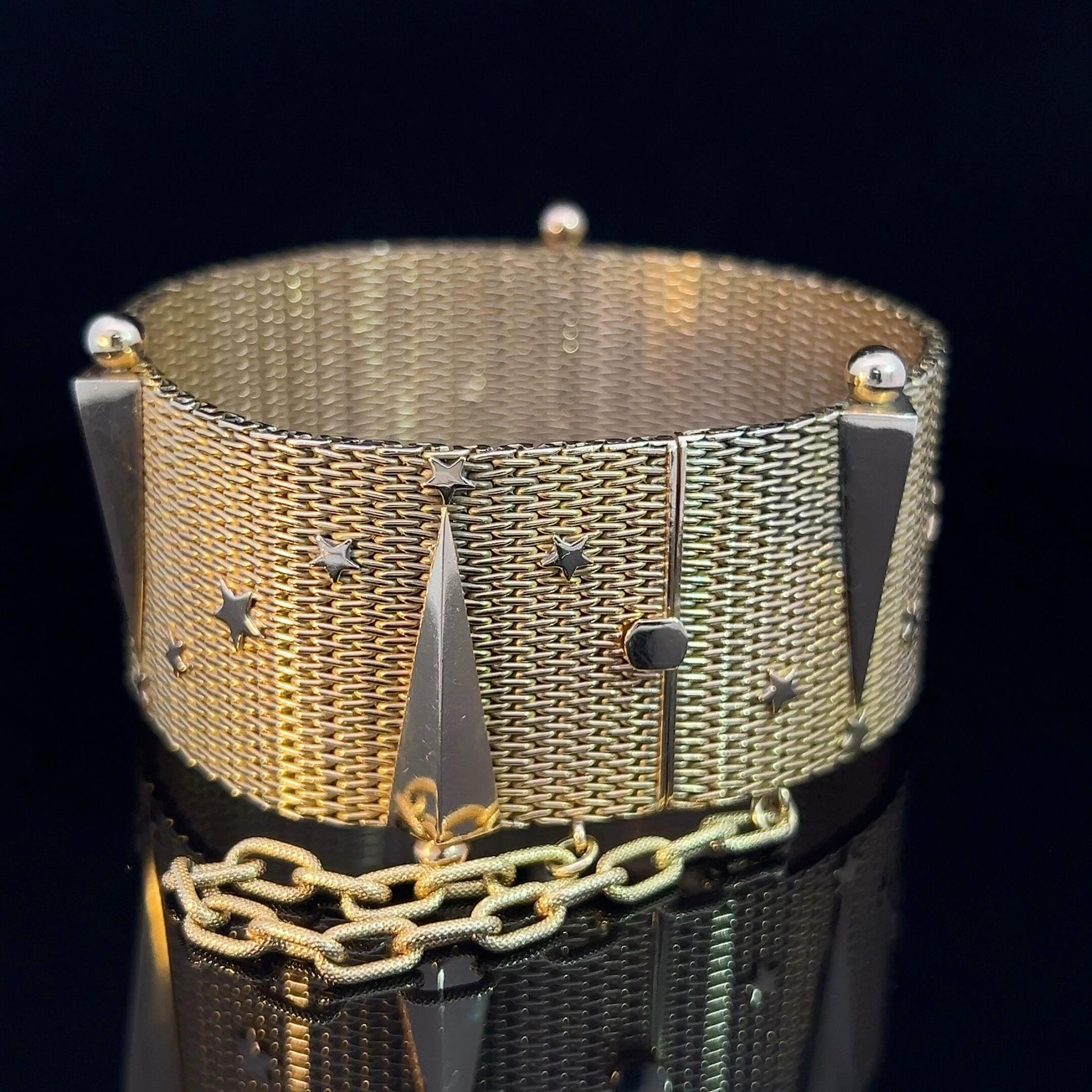 One superb 18k rose-gold European-made mesh bracelet adorned with ‘stars and raised comets’. Tongue catch and large embossed safety chain.

Metal: 18k yellow gold
Measurements: Length 18cm, width 2.7cm
Weight: 85.34 grams
Era: Retro Circa 1960s

The
