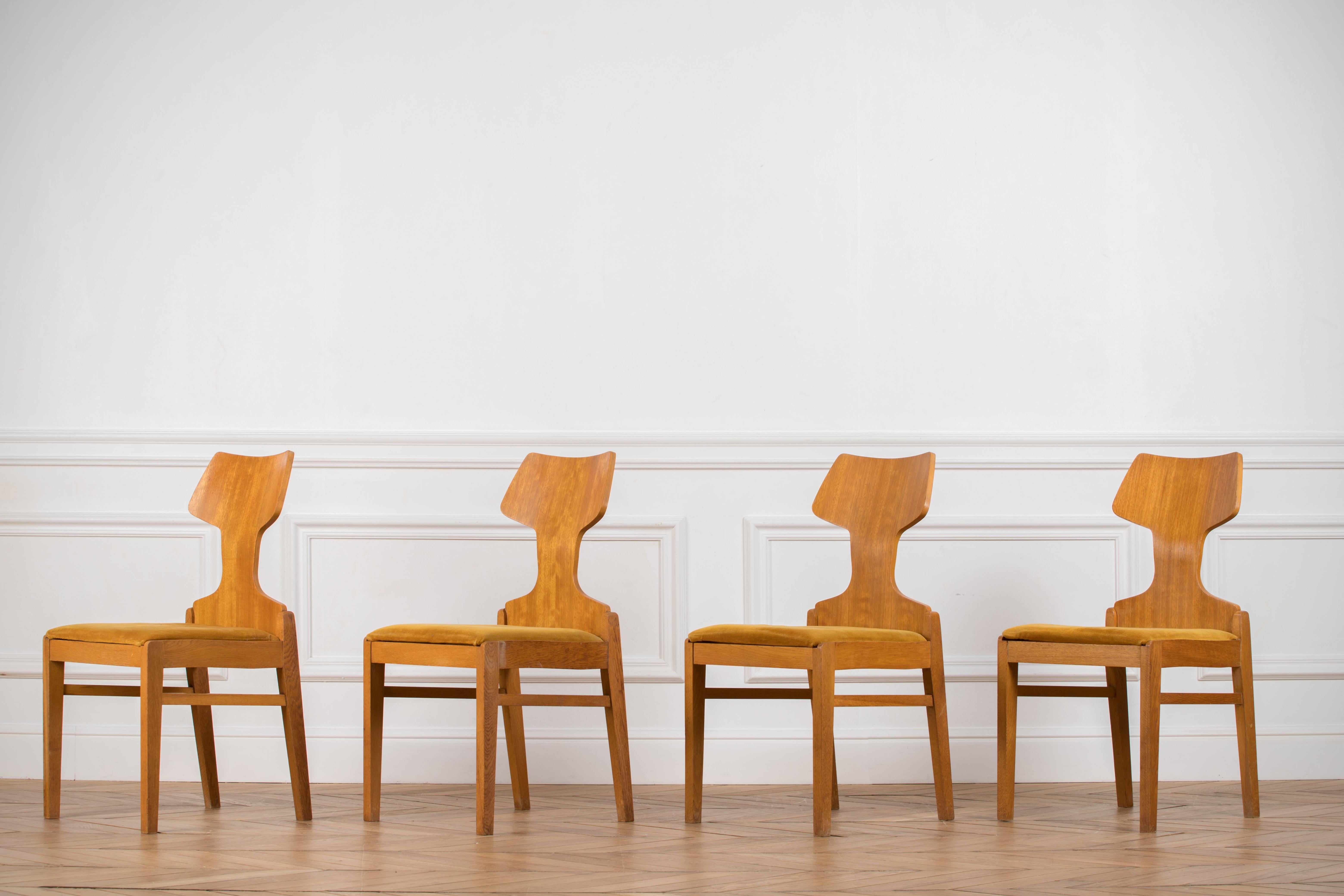Set of four 1960s dining chairs designed by Alphonse Loebenstein for Meredew (Stamped by maker).
Oak bases and bent plywood backs, veneered in beech.
Original mustard velvet upholstery in good condition.
There is some discreet watermarks and