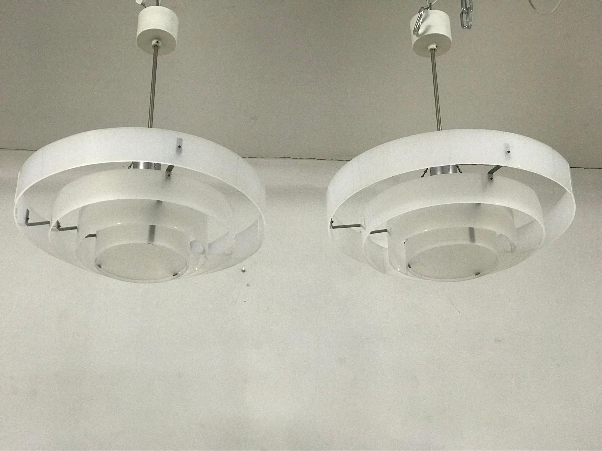 The chandelier is consist of plastic rings. The bulb socket E-27 is covered by sheet of iron. The chandelier is in original condition.