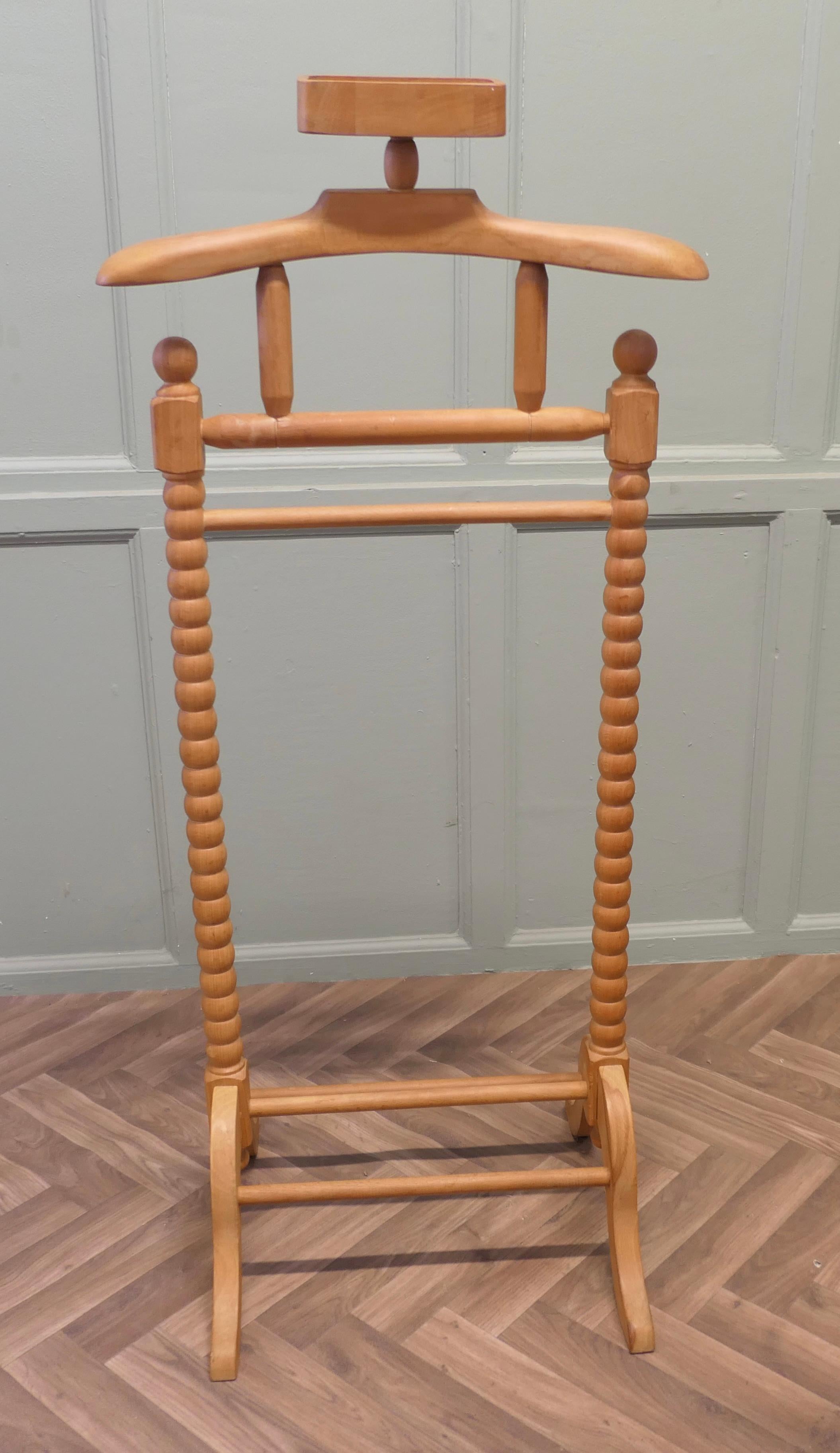 Retro Chic Gentleman’s Suit Hanger or Dumb Valet  
A very useful piece, the Valet or clothes stand is made in turned Golden beech, it has a coat hanger and will accommodate not only your jacket it also has a rail  for trousers, a shoe stand at the