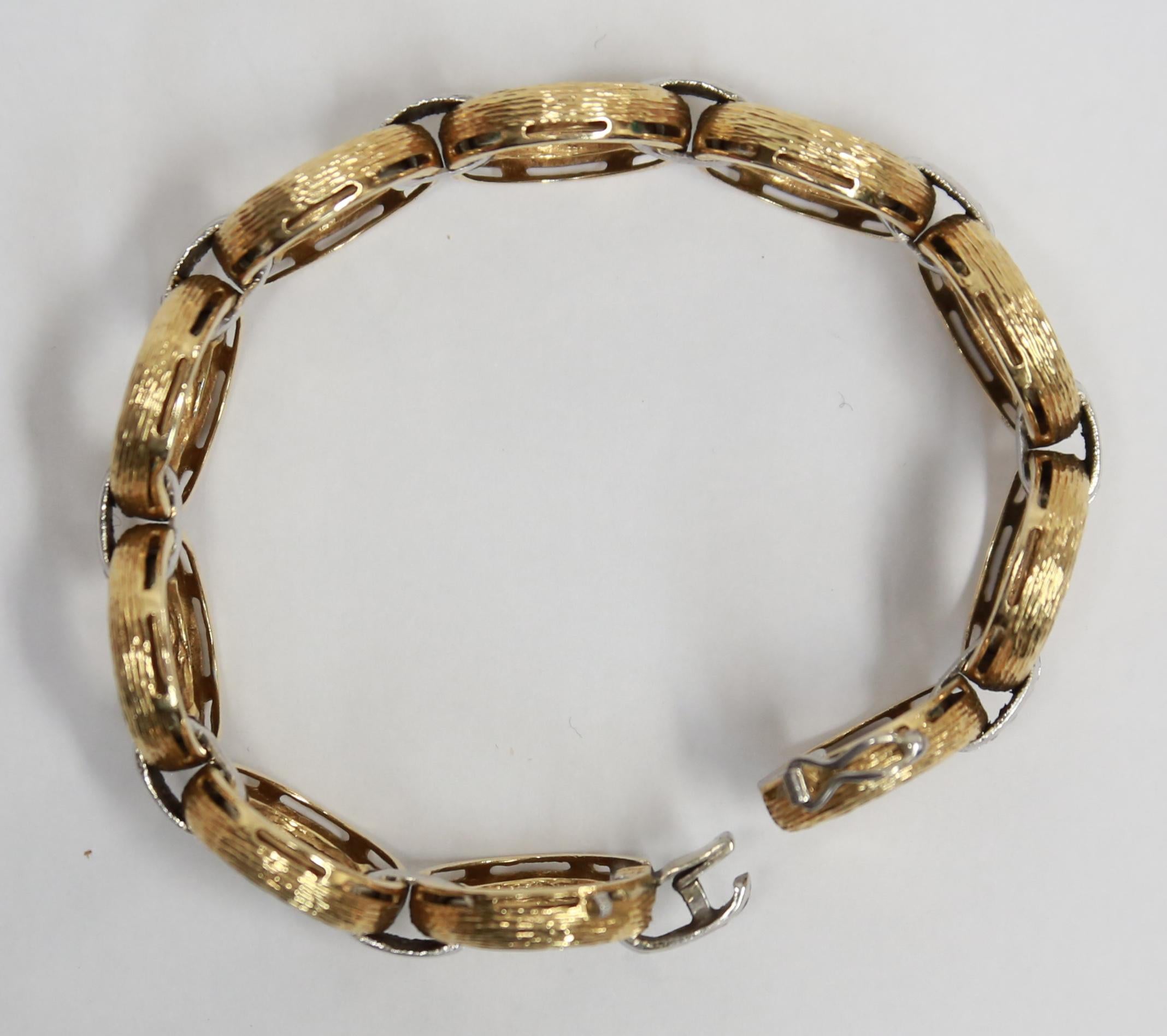 Beautiful Antique Circle and Diamond Bar Bracelet. Hand brushed yellow gold circles inter-spaced with Diamond set white Gold bars. Hand crafted in 18 Karat yellow Gold. Marked: 750 (European standard for 18K Gold). Bracelet measures approx.  7.5