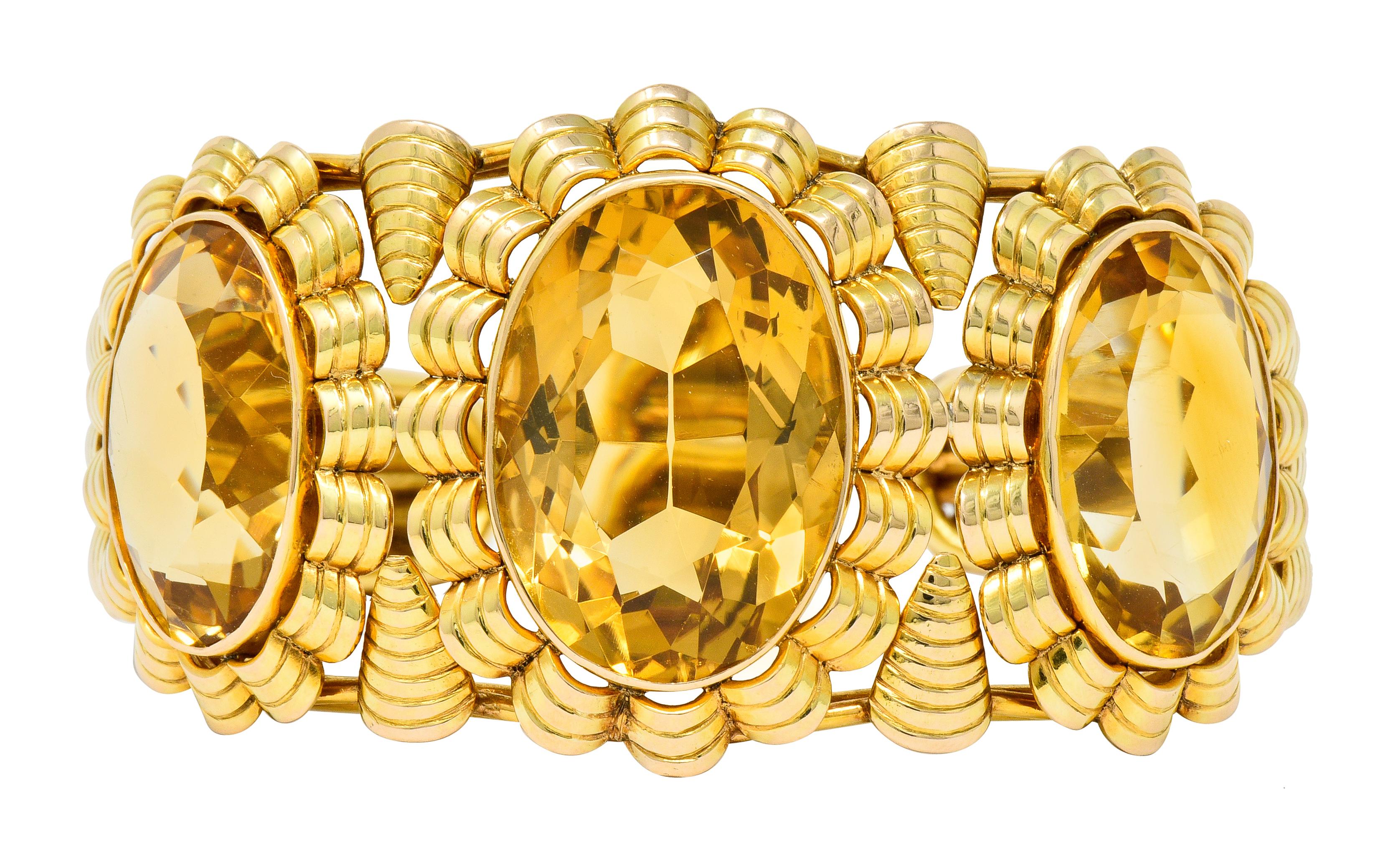 Cuff style bracelet features three oval cut citrine, each bezel set to front as a floral motif with scalloped petal surrounds and a ribbed texture

Citrine weighs in total approximately 56.95 carats and is transparent with a very well-matched light