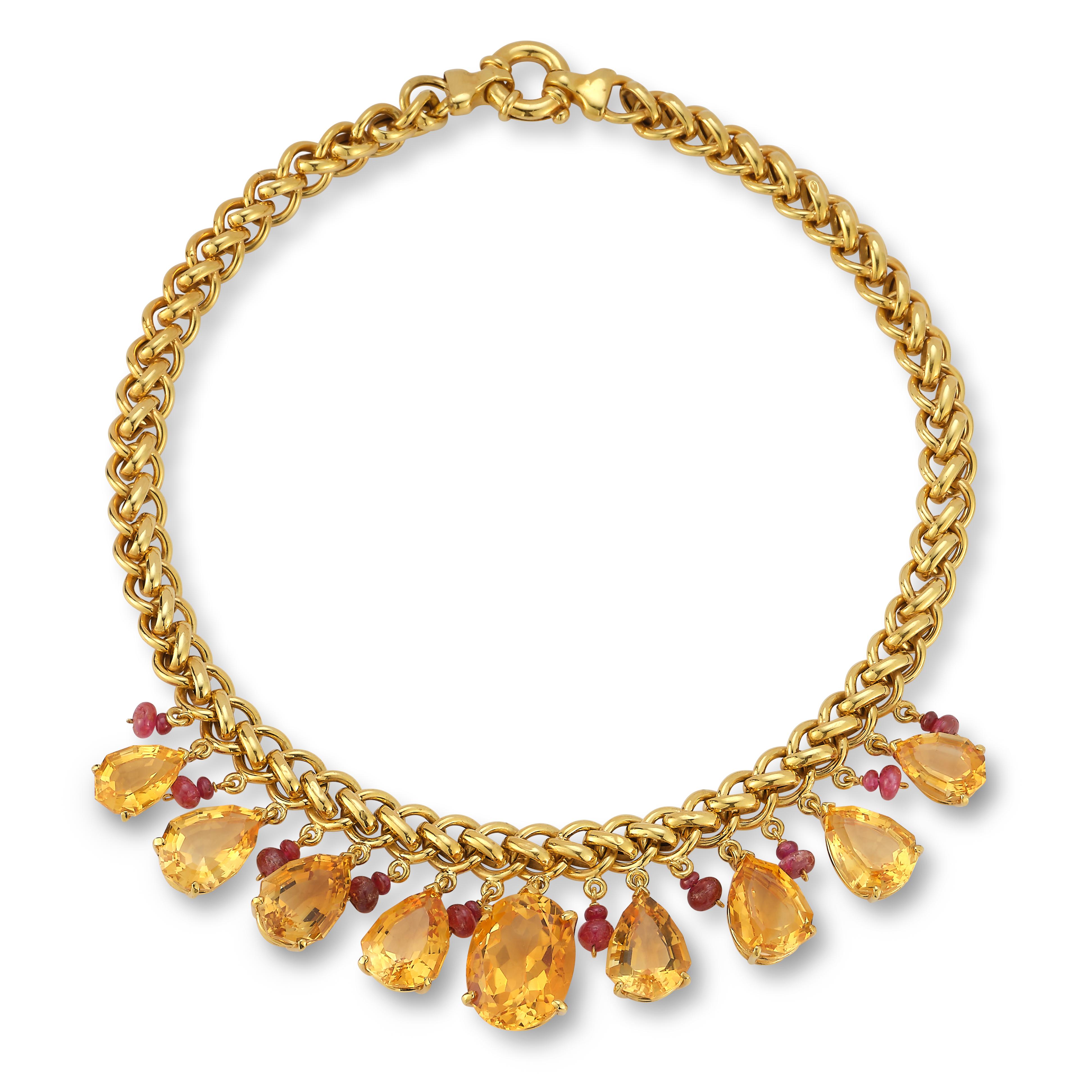 Pear Shape Citrine & Ruby Drop Necklace , A row of graduated citrines & cabochon rubies attaching to a 18k yellow gold chain. 

Citrine Weight: approximately 79.43 cts 

Ruby Weight: approximately 11.60 cts 

Measurements: 14.5