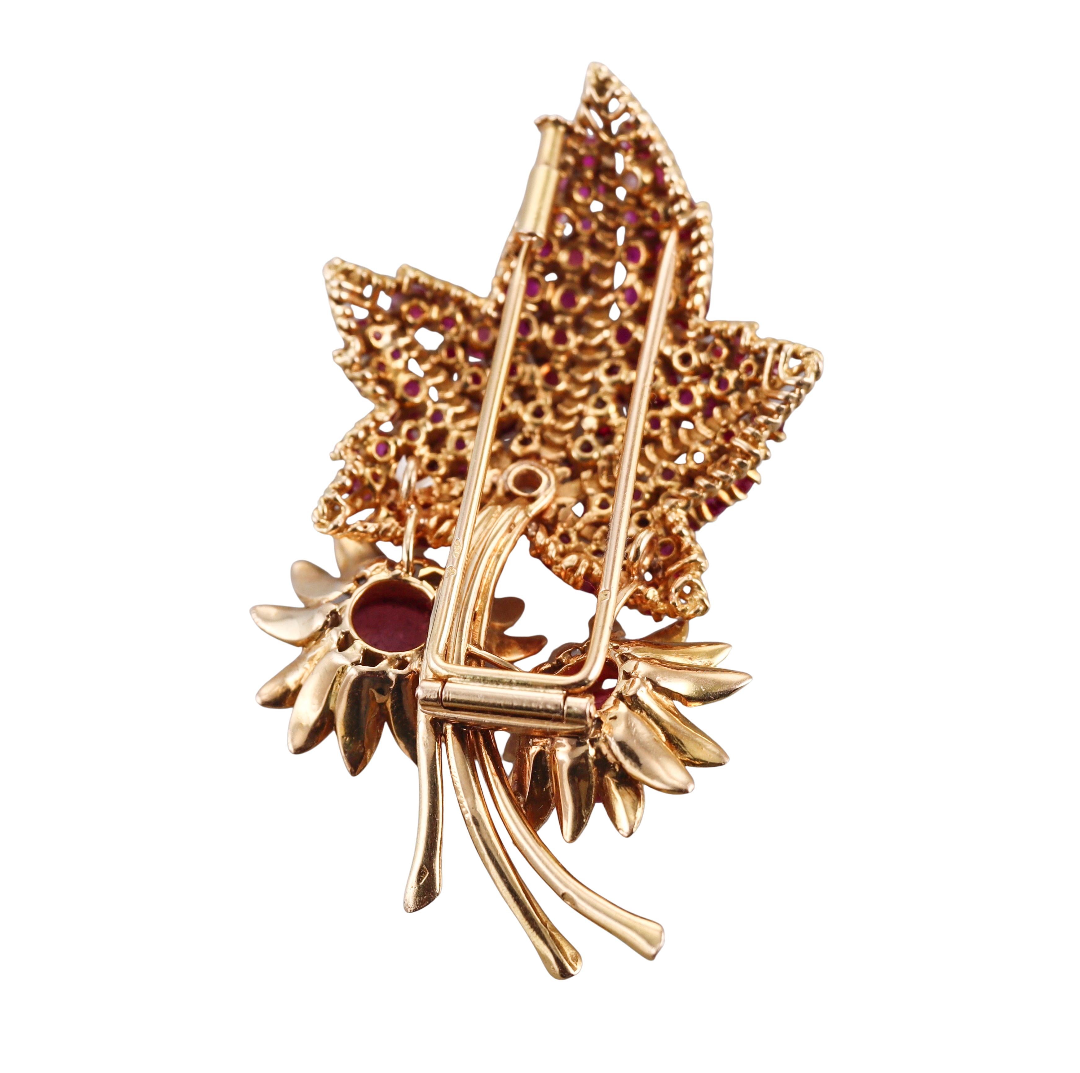 Continental European made 18k yellow gold vintage brooch, depicting a leaf, set with approx. 0.25ct H/Si1 diamond, surrounded with rubies and two pink tourmaline cabochons. 
Brooch measures 2 5/8