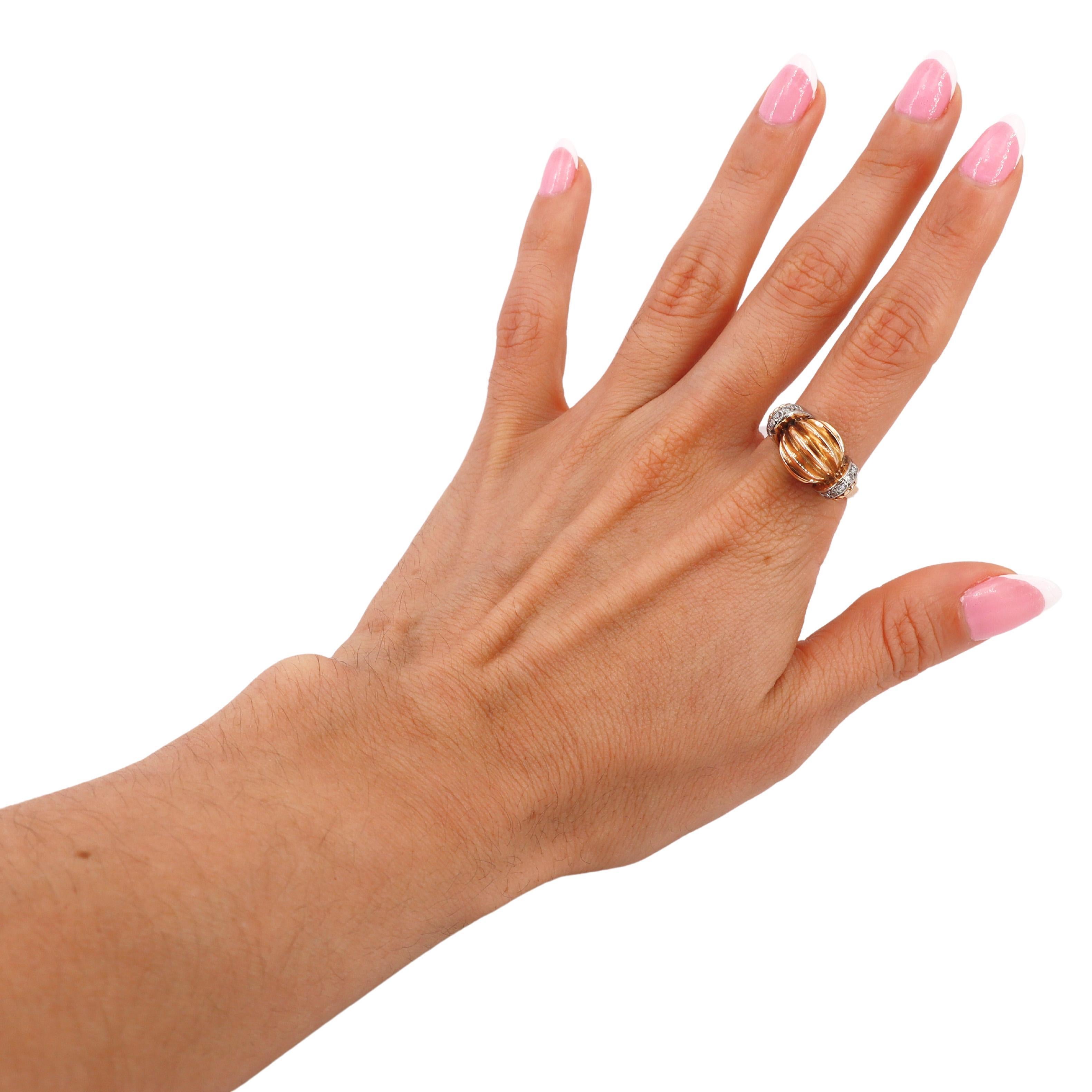 This exquisite Retro Deco bombe fluted ring, crafted in 1935, is a stunning example of the elegance and craftsmanship of the era. Made from a combination of 18kt yellow gold and platinum, the ring features a bold bombe fluted design that exudes