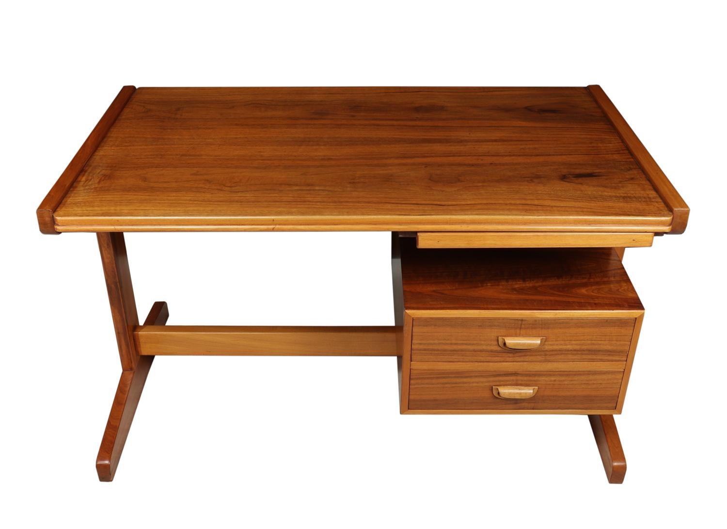 Retro desk in walnut, circa 1960
A good sized writing desk with two drawers and pull out slide produced in walnut with sculpted handles, the desk has been fully polished and is in excellent condition throughout

Age: 1960

Style: Mid-Century