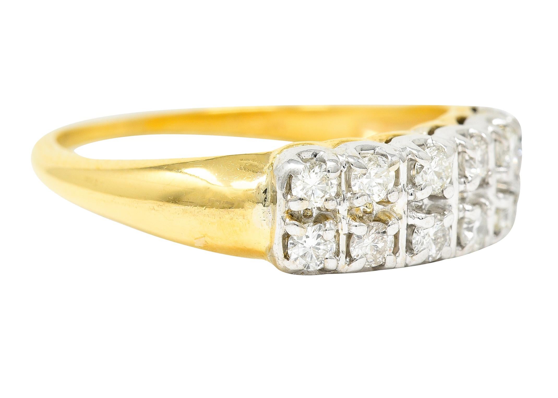 Band ring is set to front with two rows of diamonds. Each individually set in white gold forms. Weighing in total approximately 0.35 carat - H/I color with SI clarity. Completed by a polished yellow gold shank. Tested as 14 karat gold. With partial