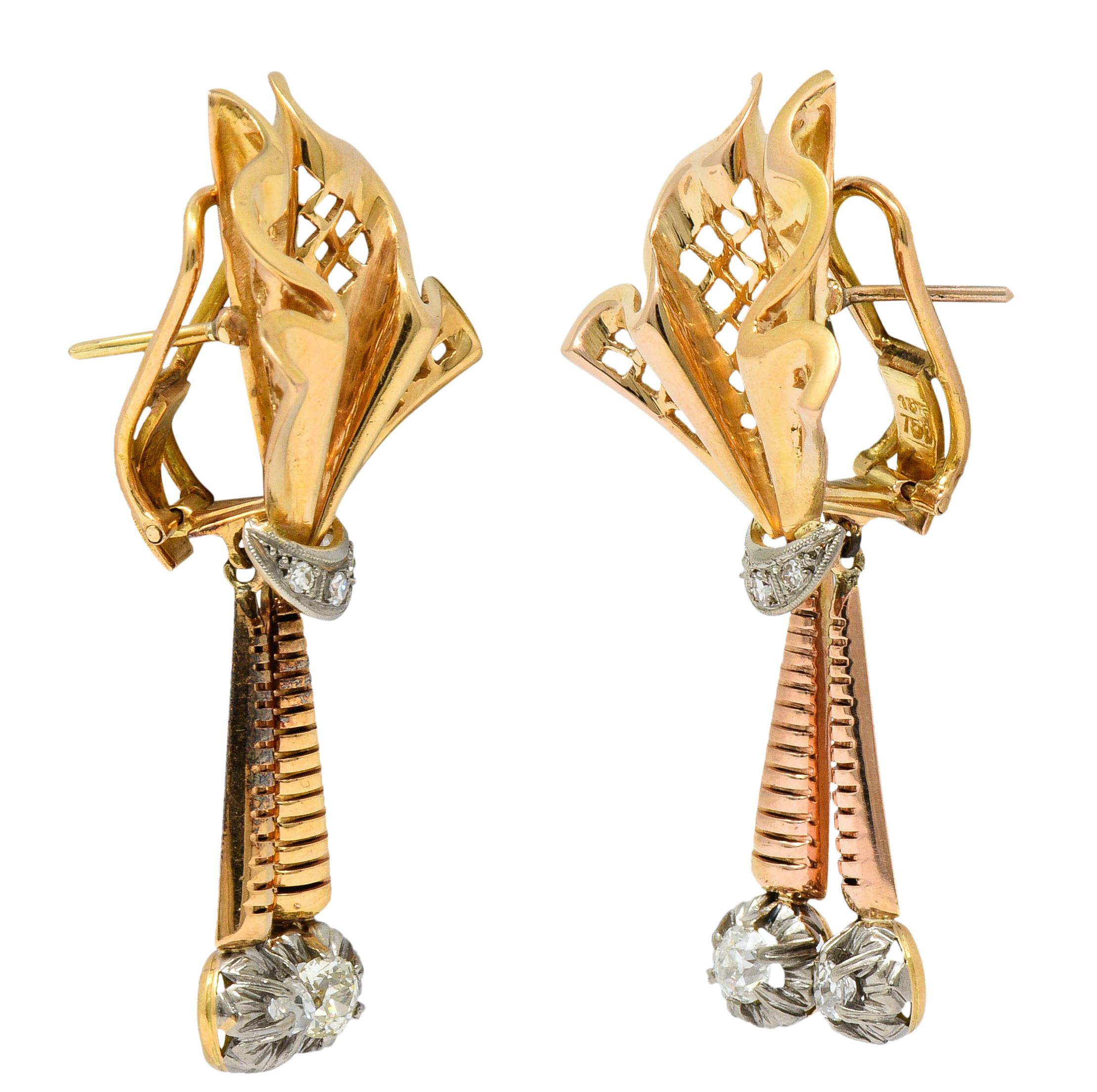Drop earrings are designed as rouched ribbon surmounts with a pierced trellis motif; yellow gold

Suspending two articulated and deeply ridged rose gold bars

With white gold areas accented by old mine and single cut diamonds

Weighing in total