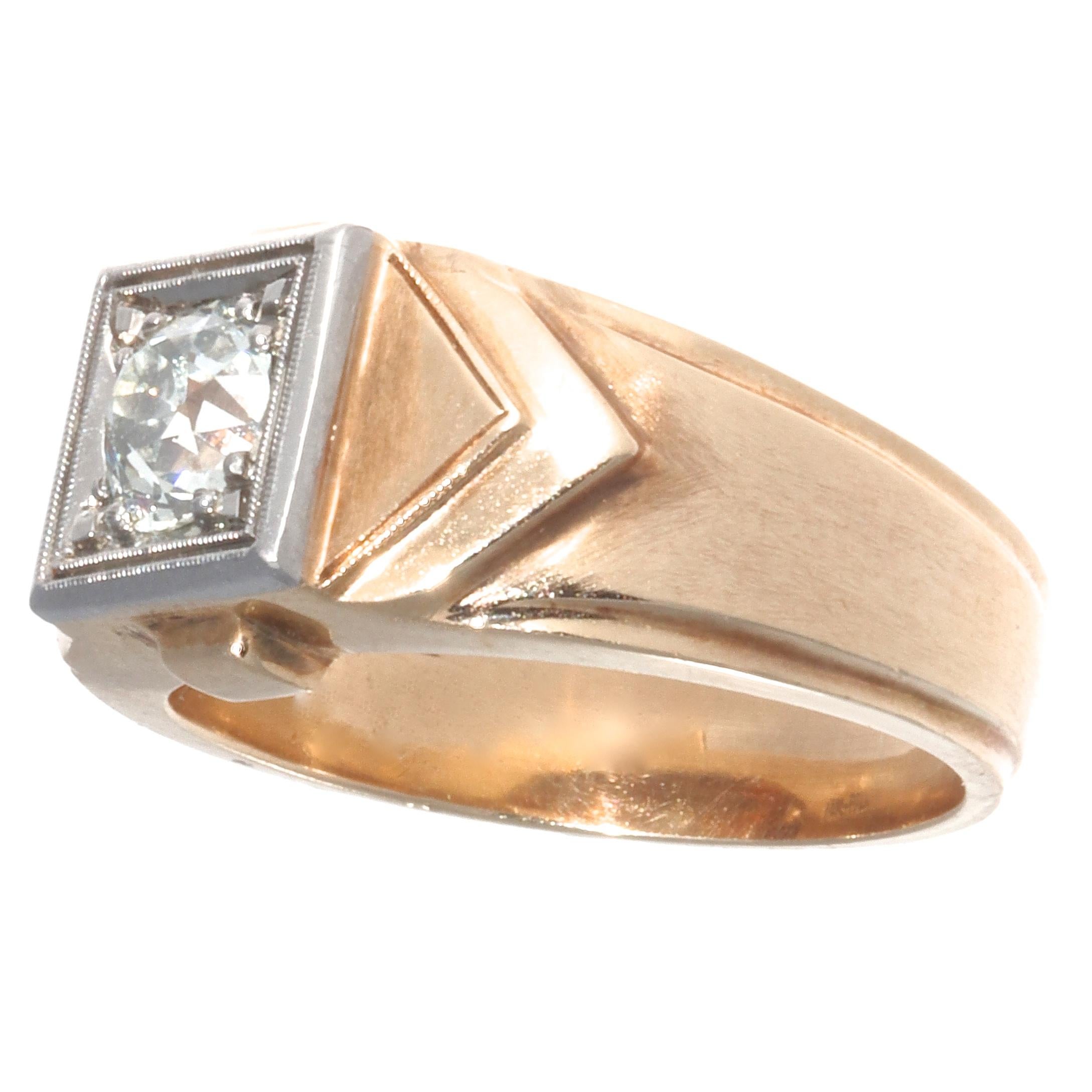 The retro period was all about bold, gold, statement pieces. And this ring is no exception. This sophisticated, unisex retro diamond  ring features an old mine cut diamond, approximately 1.00 carat, O-P color, SI1 clarity. The diamond is set in