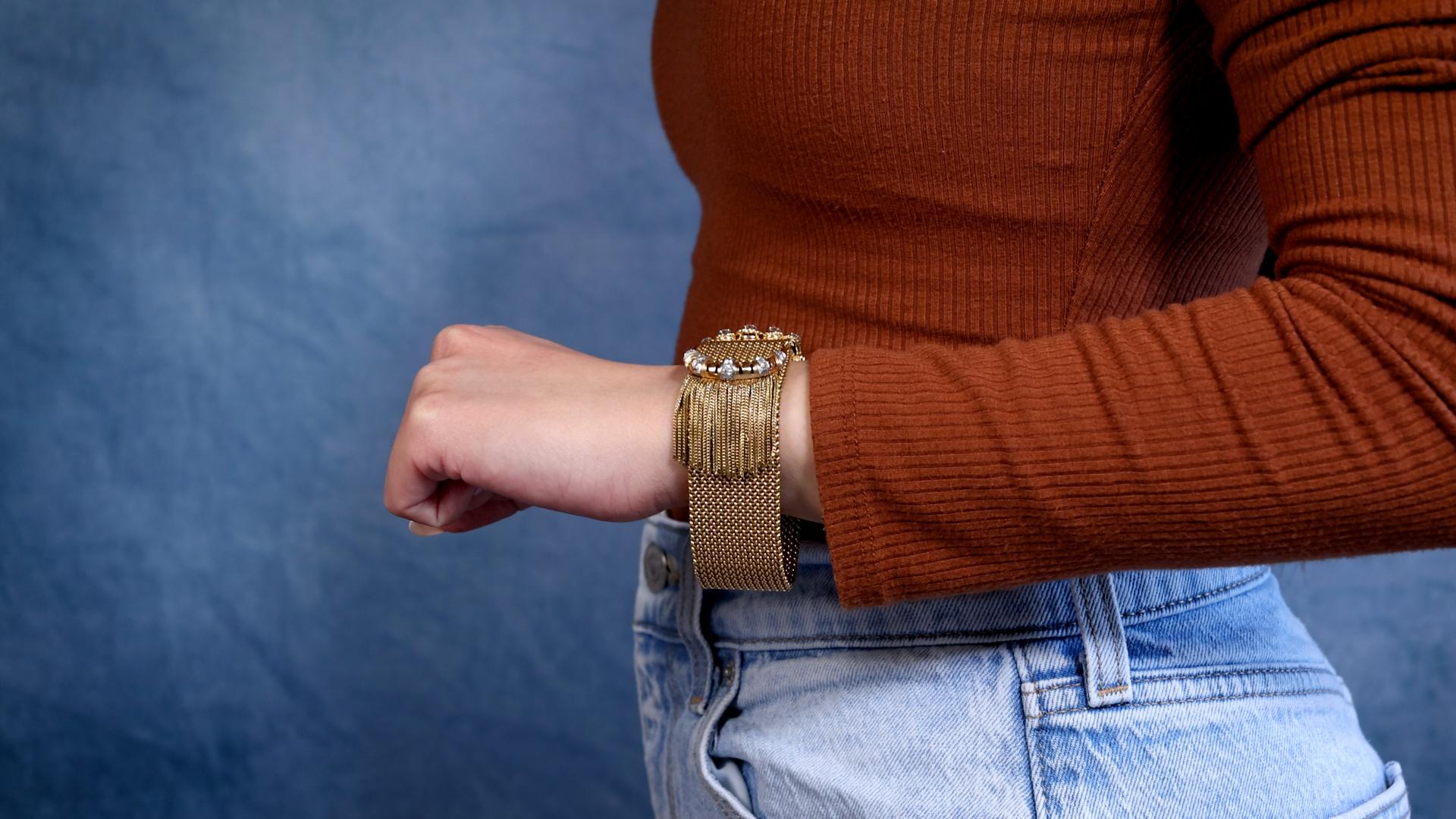 One Retro Diamond 18k Yellow Gold Fringed Belt Buckle Bracelet. Featuring 18 round brilliant and single cut diamonds with a total of eight of approximately 1.75 carats, graded near-colorless, VS-SI clarity. All stones are graded in their mounting.