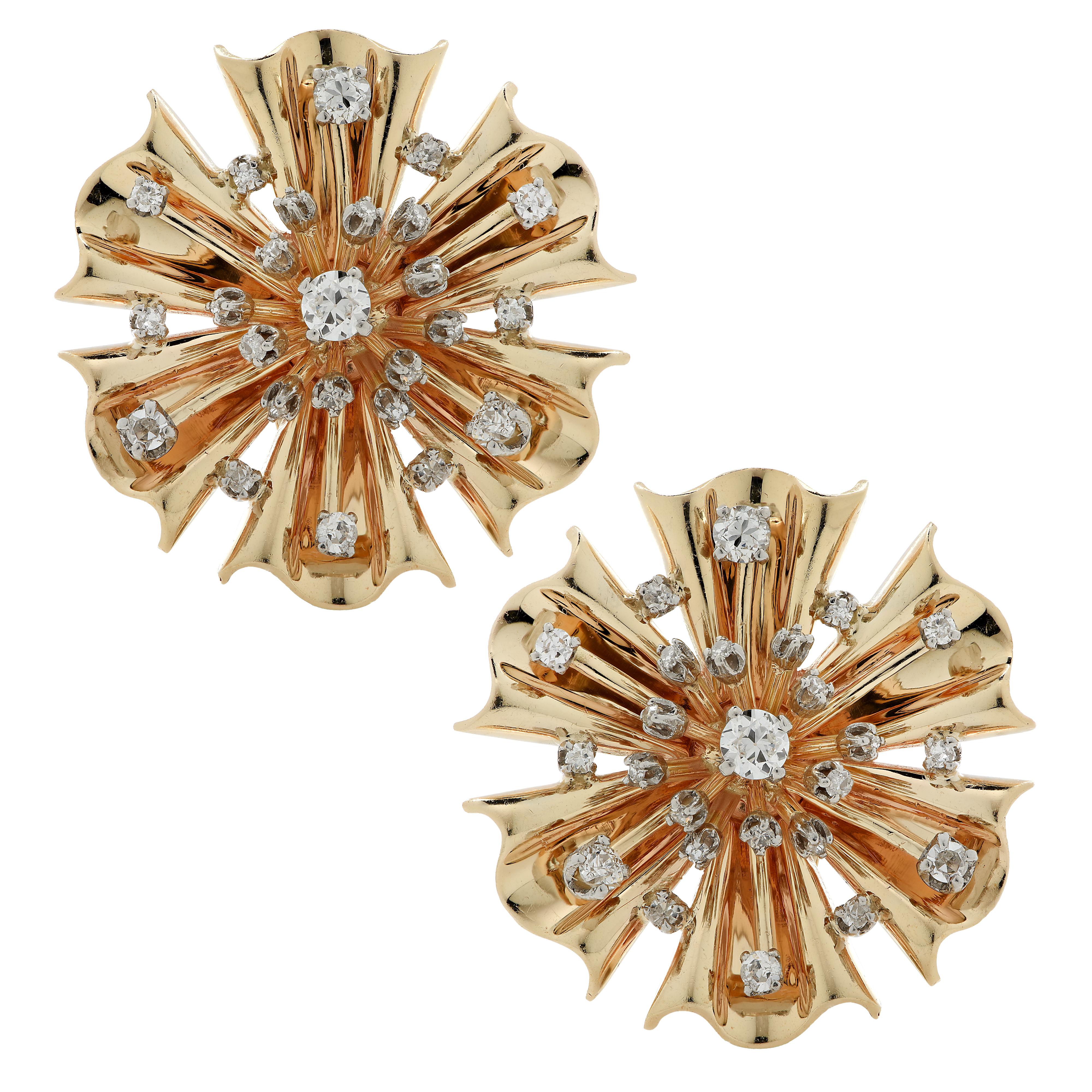 Stunning retro brooch pin/pendant and earring set crafted in yellow gold, featuring 80 old mine cut and Old European cut diamonds weighing approximately 2 carats total, J-K color, SI clarity. The gold is fluted and molded into flowers adorned with