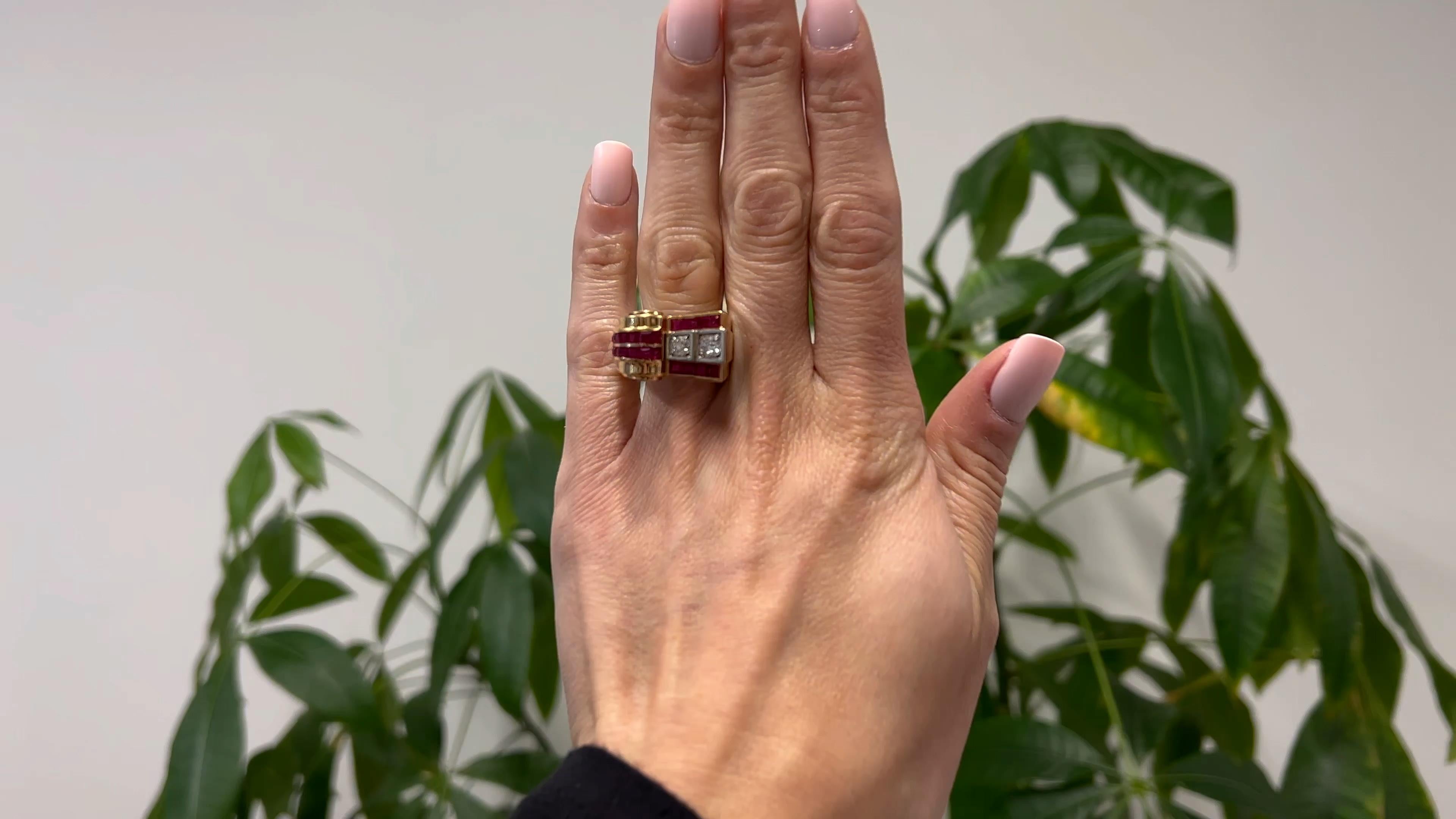 One Retro Diamond and Ruby 18k Yellow Gold Platinum Tank Ring. Featuring two old European cut diamonds with a total weight of approximately 0.60 carat, graded H-I color, I1 clarity. Accented by 22 square step cut rubies with a total weight of