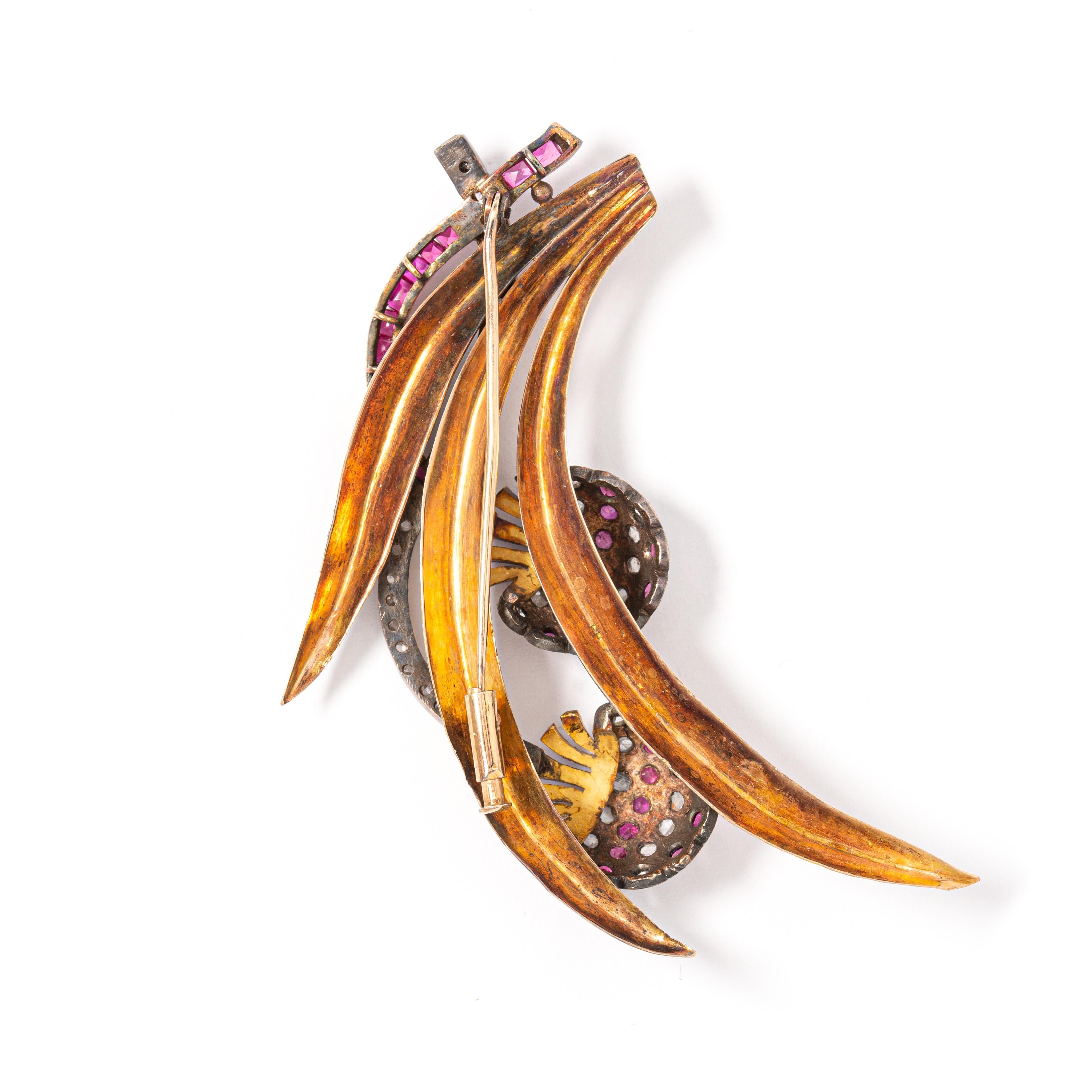 Retro Diamond and Ruby Brooch in 14K gold and 800 silver set with ruby and rose cut diamonds. 
Circa 1940. 
Length: approximately 8.50 cm (longest). Width 5.50 cm (widest). 
Gross weight: 21.22 grams.