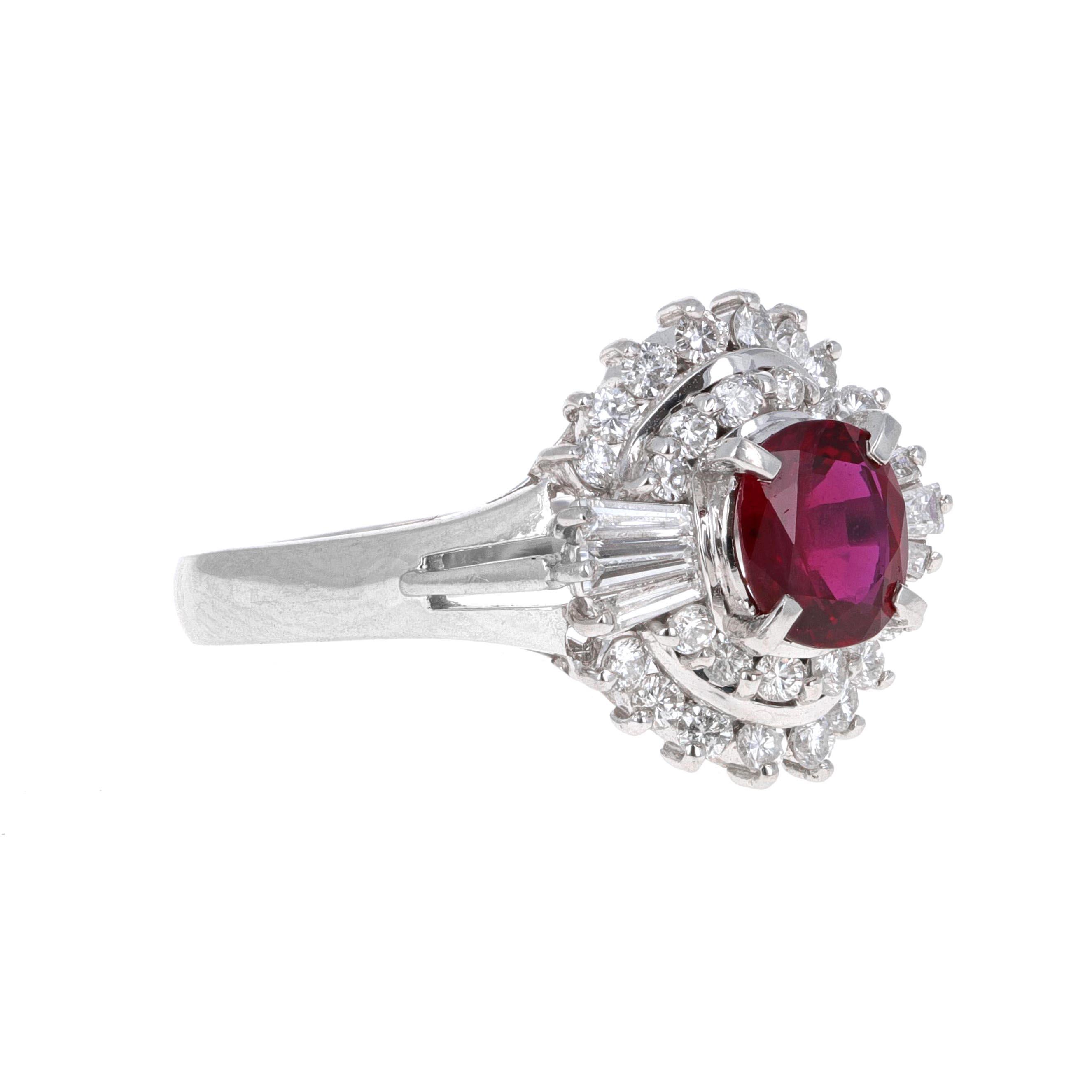 Retro diamond and ruby cocktail ring. The center stone weighs 0.91 carats and is an oval shape. Surrounding the ruby are round and tapered baguett diamonds. There is a total carat weight of 0.61 carats in diamonds. The ring is made in platinum and