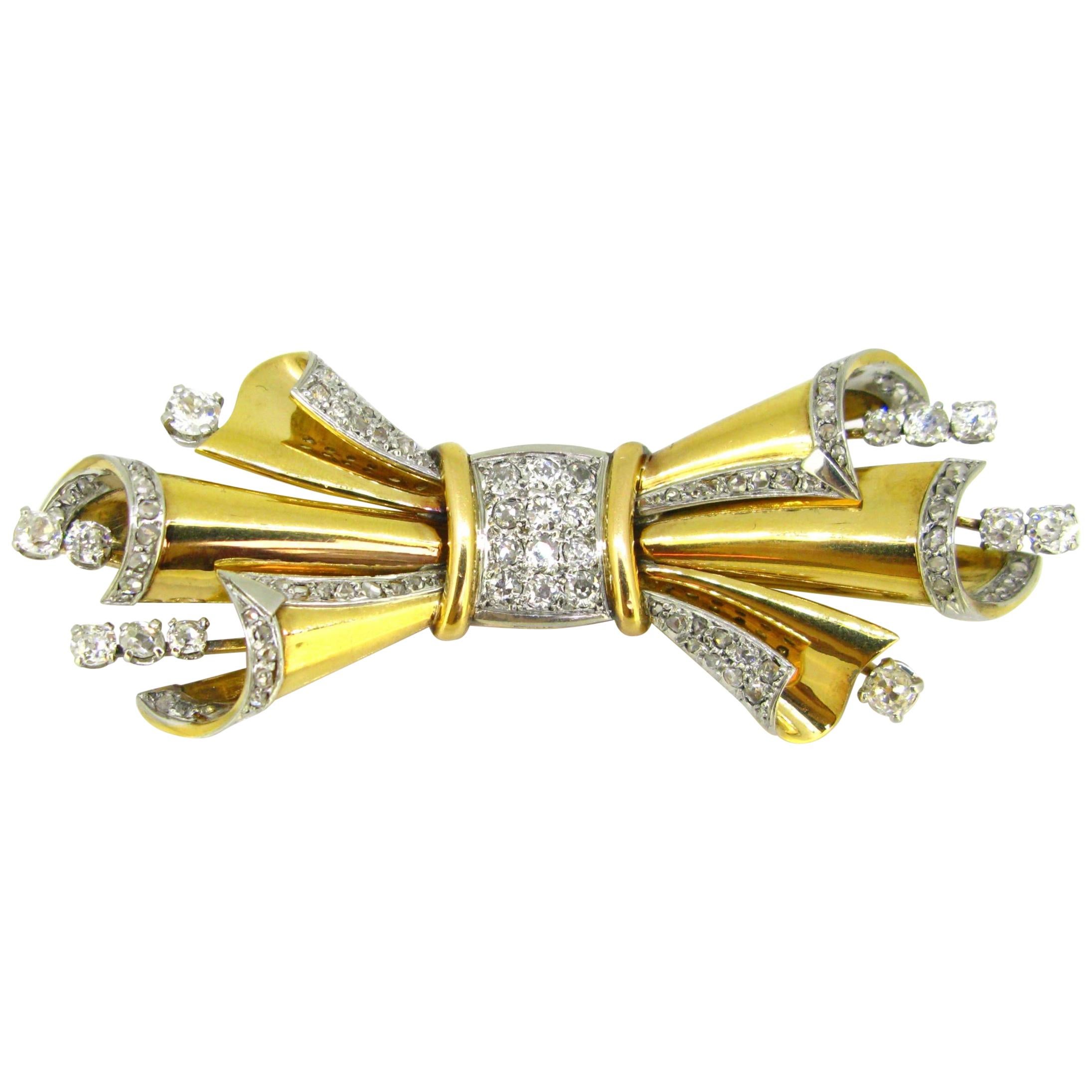 Retro Diamond Bow Ribbon Brooch, 18 Karat Yellow Gold and Platinum, circa 1940