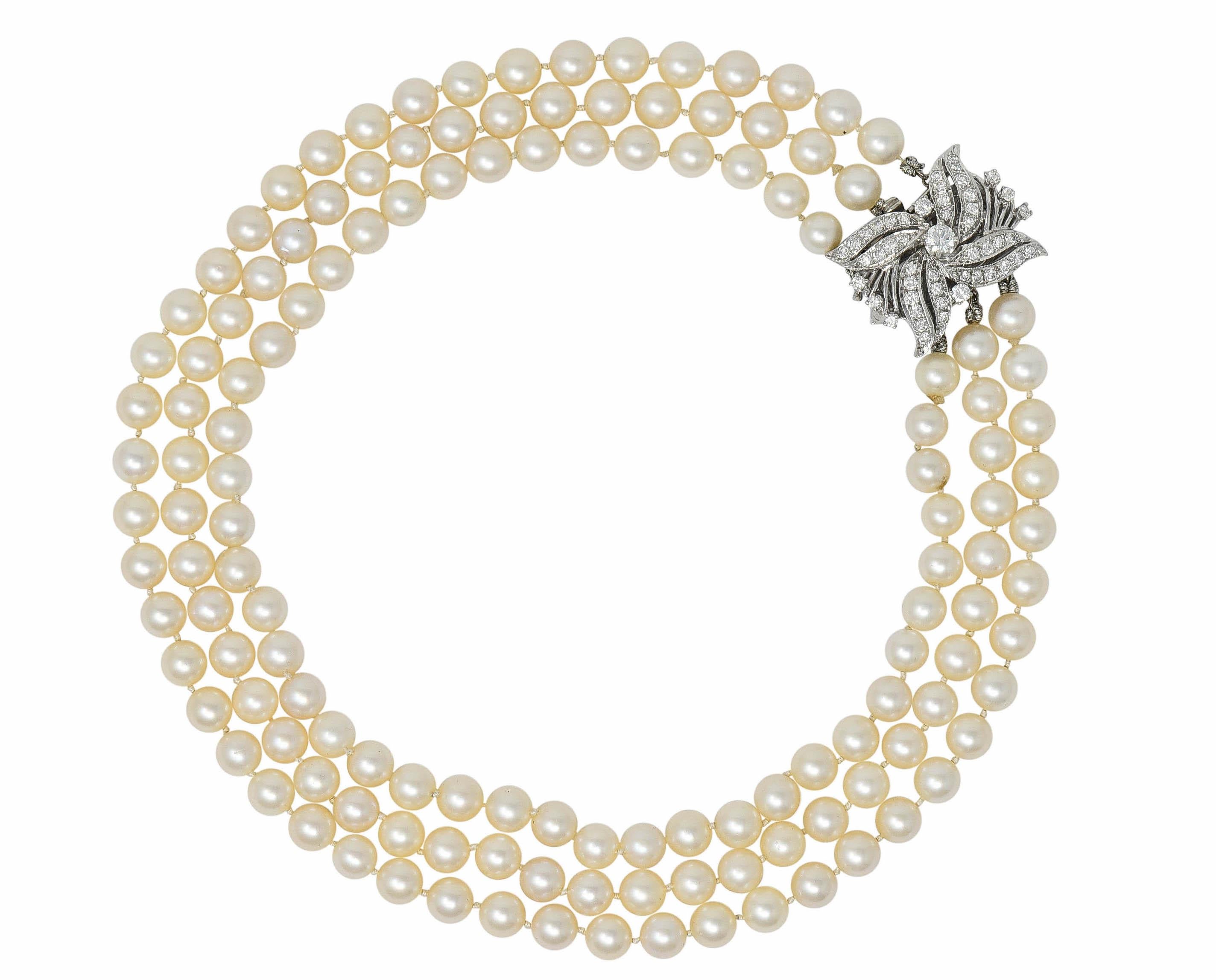 Necklace is comprised of three hand-knotted stands of 7.2 mm round cultured pearls

Very well-matched cream body color with rosè overtones and very good luster

Completing as a white gold clasp with detachable floral diamond brooch

Total diamond