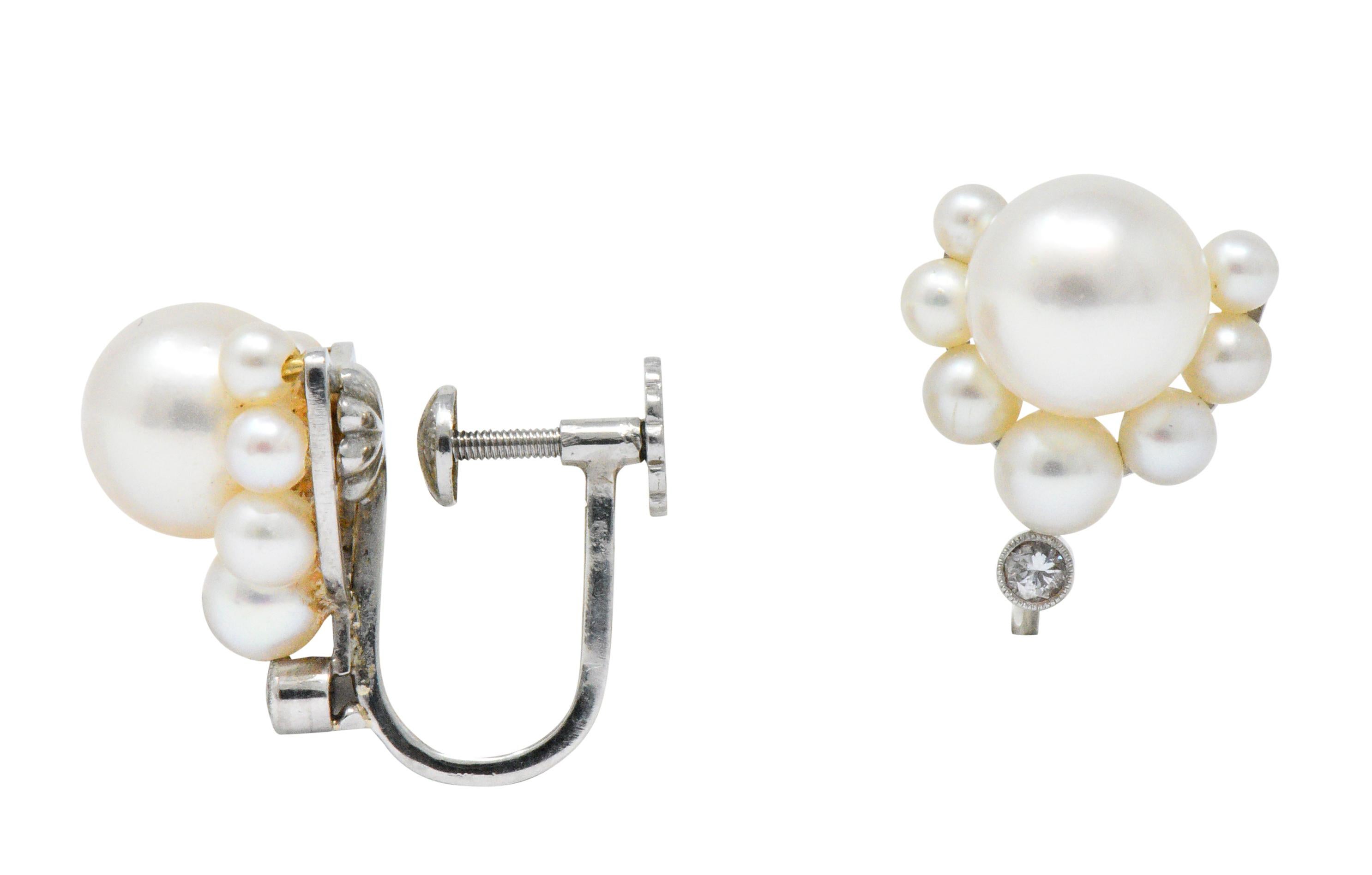 Each earring centers a round 8.1 mm cultured pearl with white body color and rosé overtones; exhibits excellent luster and surface quality 

Accented by seven more round cultured pearls that graduate in size, measuring 2.7 to 4.4 mm; white to light