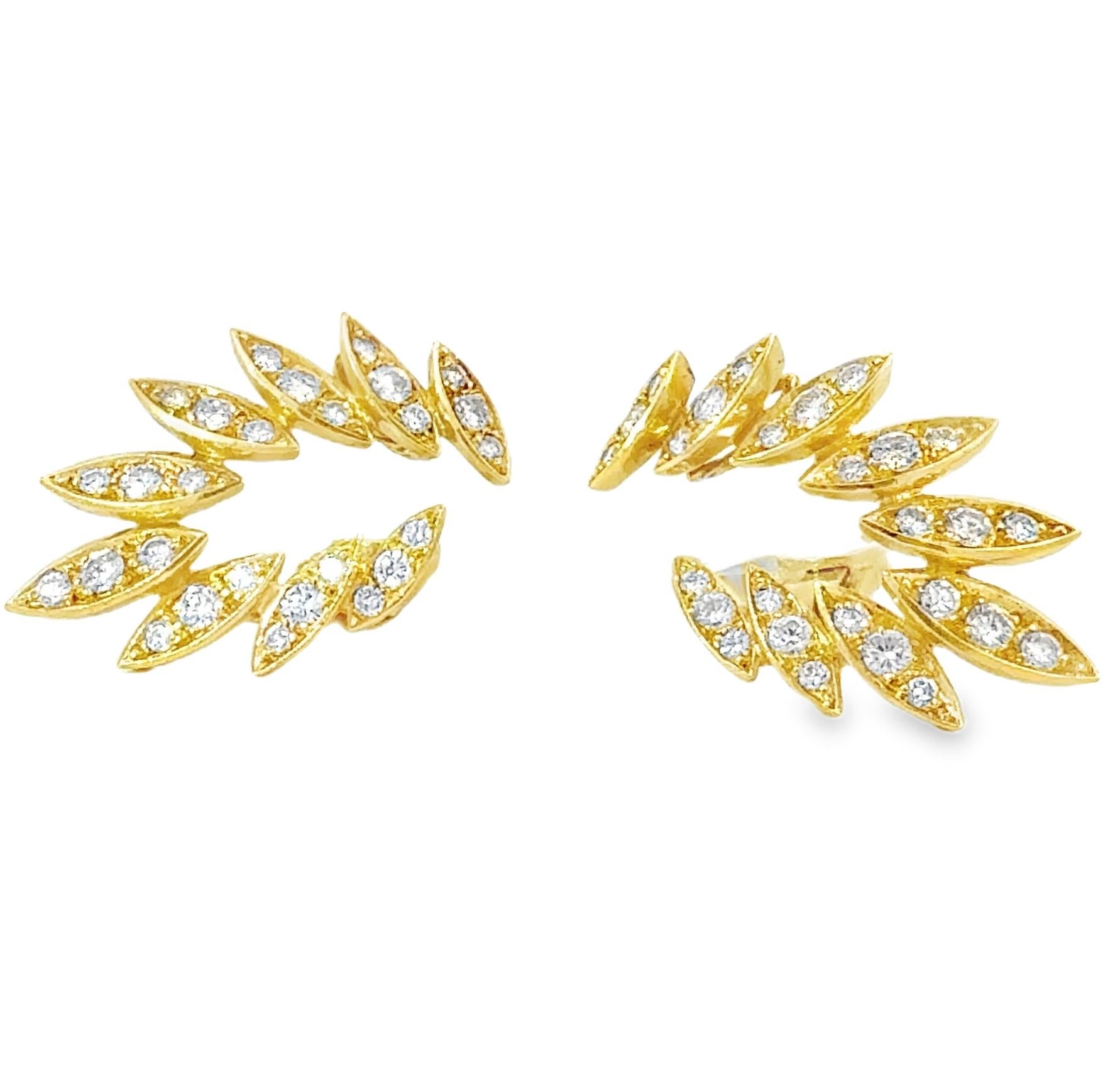 These retro diamond ear climber earrings in 18K yellow gold are a stylish and sophisticated statement, perfect for collectors and trendsetters alike. Featuring 54 round brilliant diamonds set in marquise-shaped gold bezels, these earrings offer