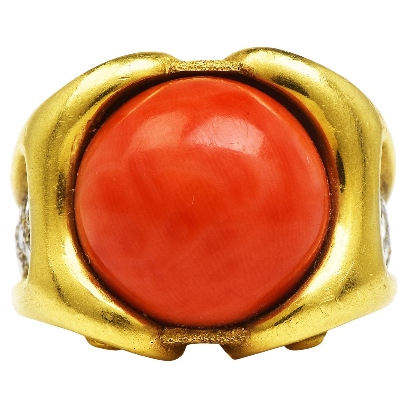 Vintage Retro cloud side designs, with a Red Coral Genuine Gemstone design.

Crafted in solid 18K Yellow Gold, with a satin finish.

A Deep red natural color center coral adorned by diamonds on the sides traditional cocktail ring,

 The center is