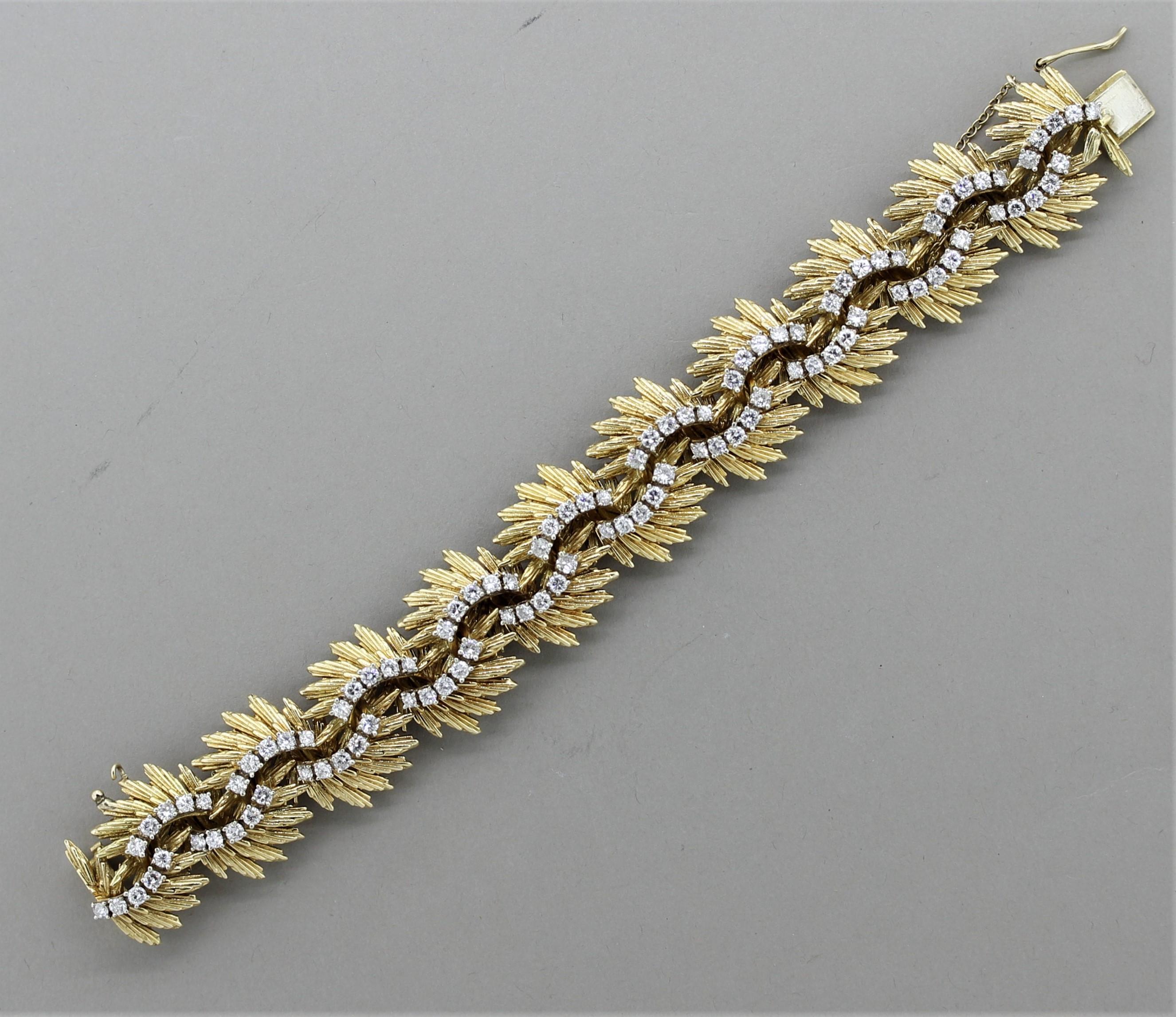 A bold and original piece from the retro period! Made in the 1940’s this stylish bracelet features approximately 6 carats of round brilliant-cut diamonds set across the piece. The gold accents have been hand-sculpted to radiate out from the bracelet