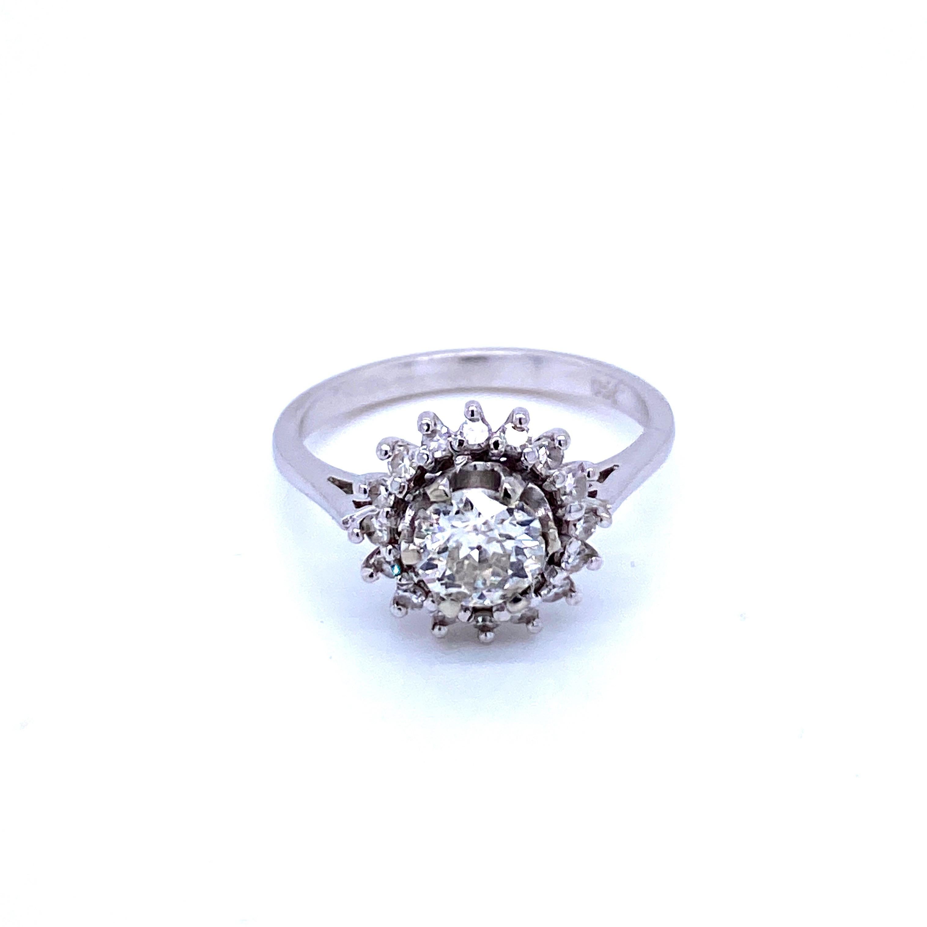 An exquisite example of Retro jewel, simple and elegant.

This ring is hand-crafted in 18k white gold, authentic from 1950', featuring in the center a large and sparkling Old mine-cut Diamond weighing approx. .90 carats, graded I color Vs2 clarity,