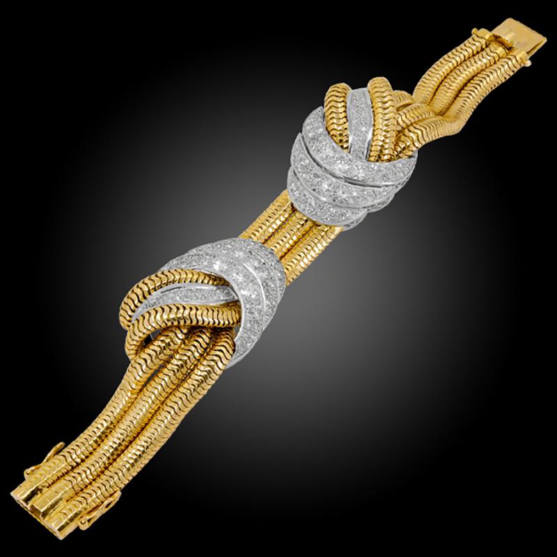 Retro Diamond Serpentine Chain Necklace Bracelet Suite in 18k Yellow and White Gold.

Old European-cut diamonds mounted in white gold with azured slightly articulated form, woven around a serpentine chain.

Serpent chain necklace inner circumference