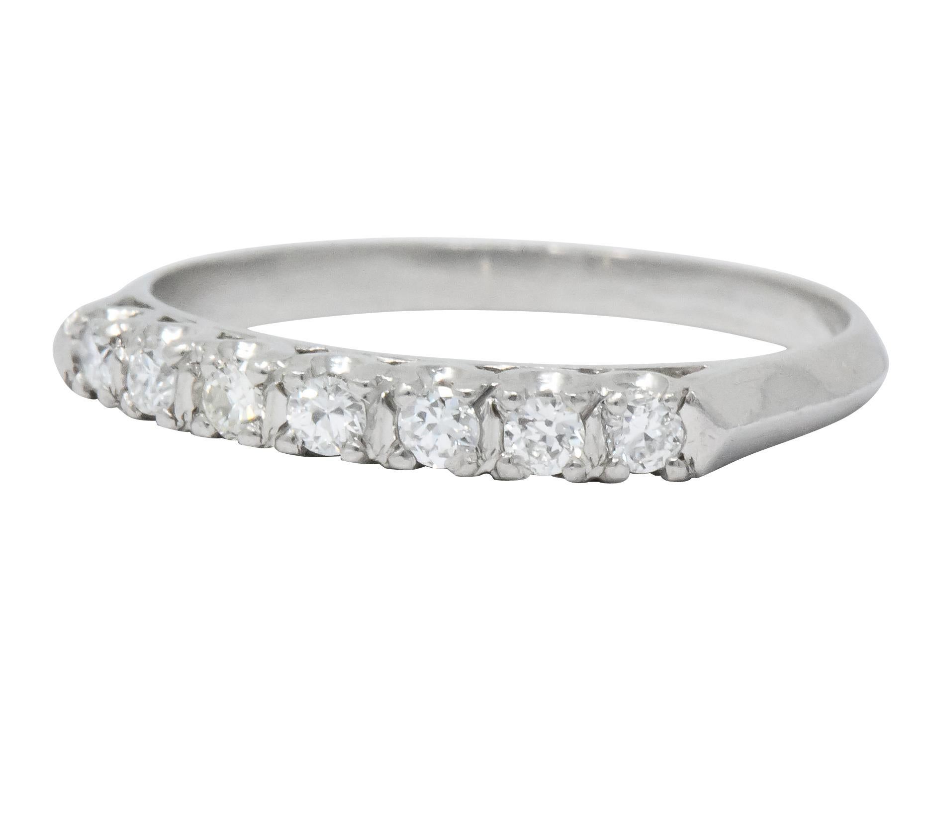 Set to front with seven round brilliant cut diamonds

Weighing approximately 0.21 carat total, eye-clean and white

Prong set with knife-edge shank

Stamped platinum

Great ring to stack

Ring Size: 6 & Sizable

Top Measures: 2.5 mm and sits 2.75 mm