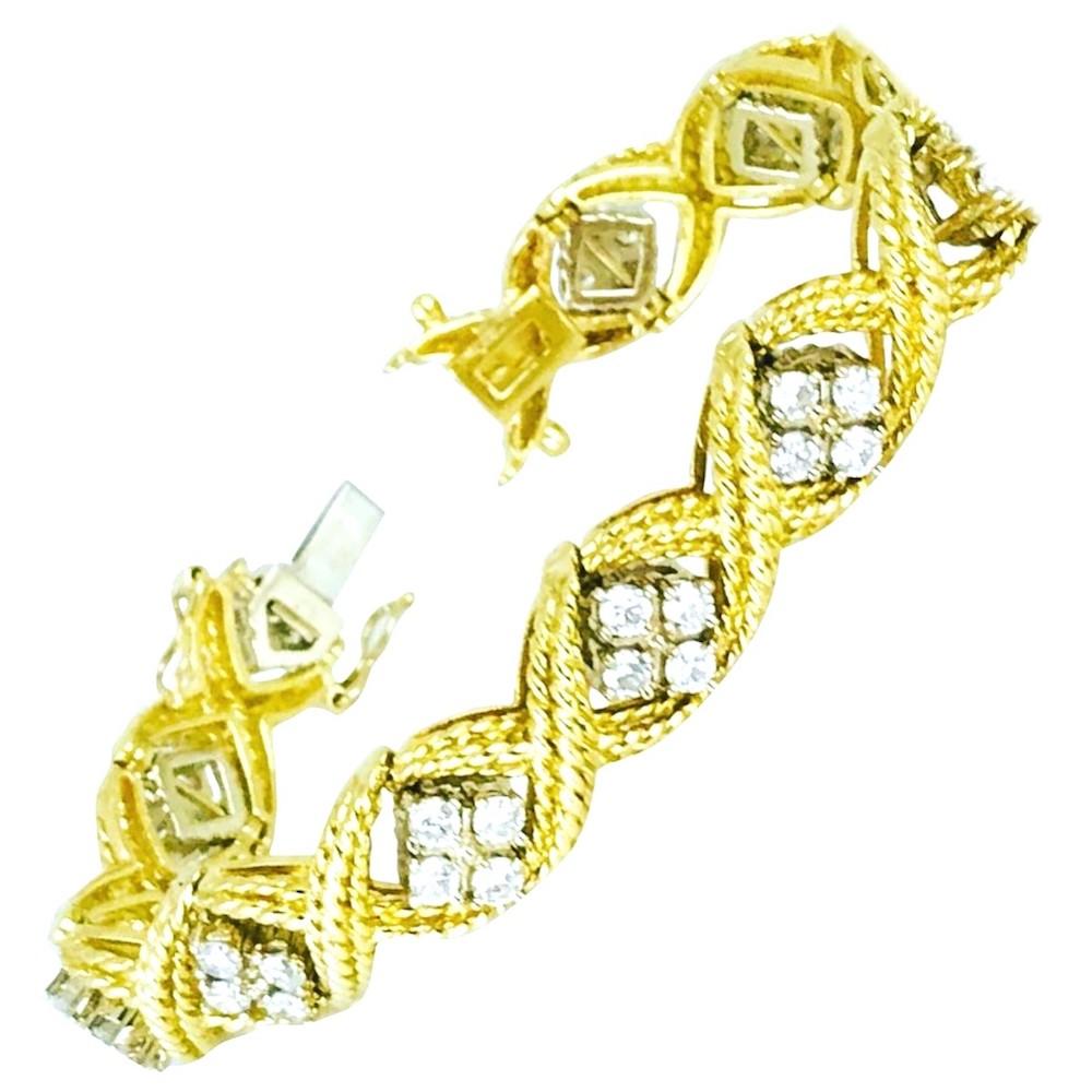 14 Karat Yellow Gold set with (44) Diamonds. The diamonds are 3.10 millimeters each (.11 points) and weigh approximately 4.84 carats in total. 
The quality of the diamonds are SI2 clarity and G-H in color. The length of the bracelet is 7 inches. GIA