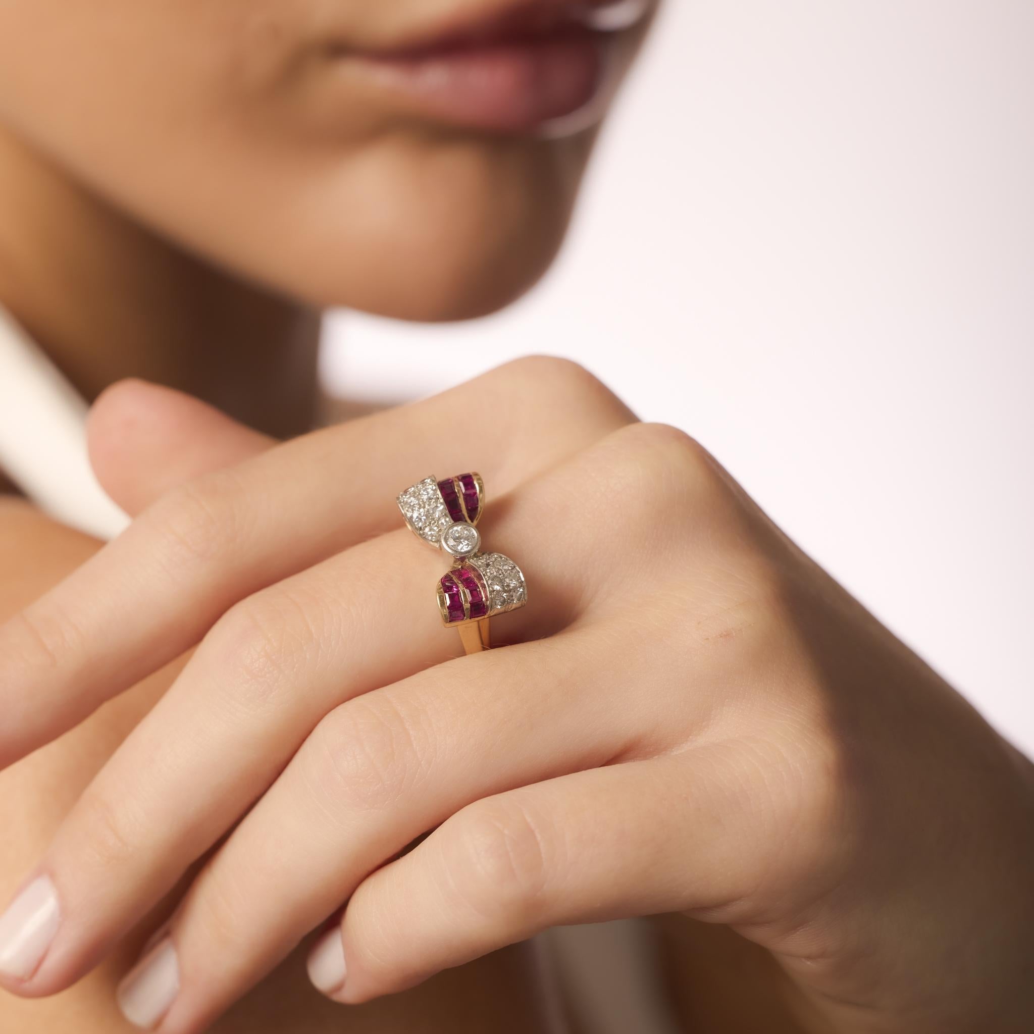 This Retro ring blends vintage charm with vibrant elegance, showcasing diamonds and rubies set in warm yellow gold with platinum accents.