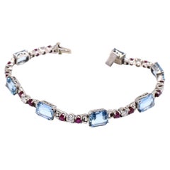 Bracelet rétro en platine avec diamants, rubis et aigue-marines