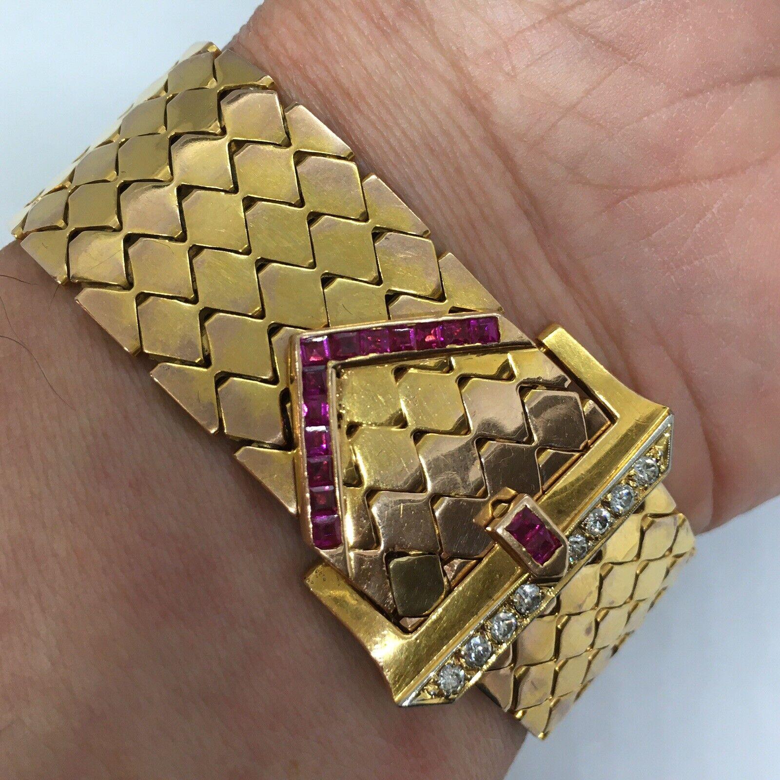 Retro Diamond Ruby Buckle Bracelet 14K American Gold 1940s

66.5 gram
Marked and tested 14K
23 mm wide
8.75 inch long
15 pieces of square cut Ruby( not tested), usage of created Ruby is common on Retro, circa 1940s,  American made jewelry.
8 pieces