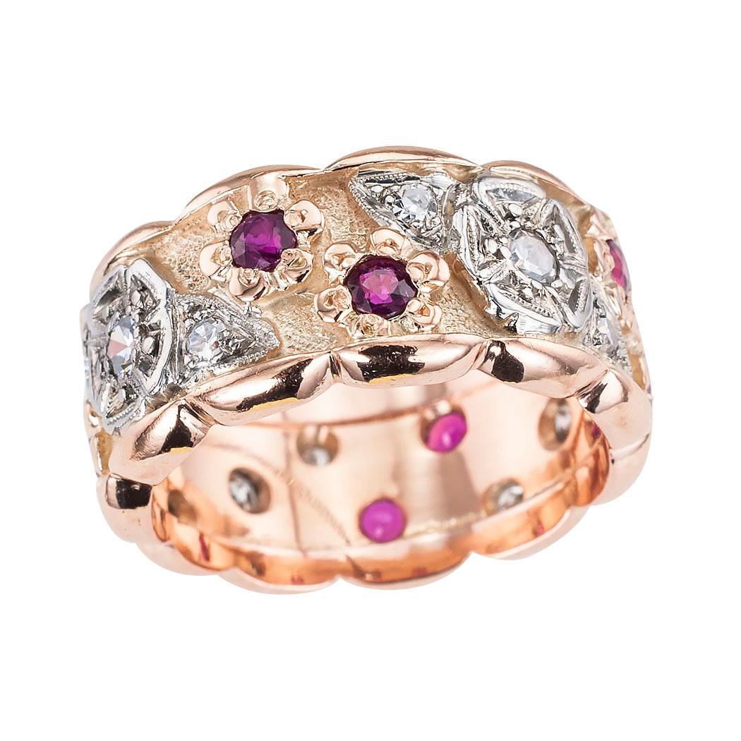 Retro diamond and ruby pink gold 10 mm wide eternity ring circa 1940, ring size 7 ¾. Love it because it caught your eye and we are here to connect you with beautiful and affordable jewelry.  Make yourself happy!  Simple and concise information you