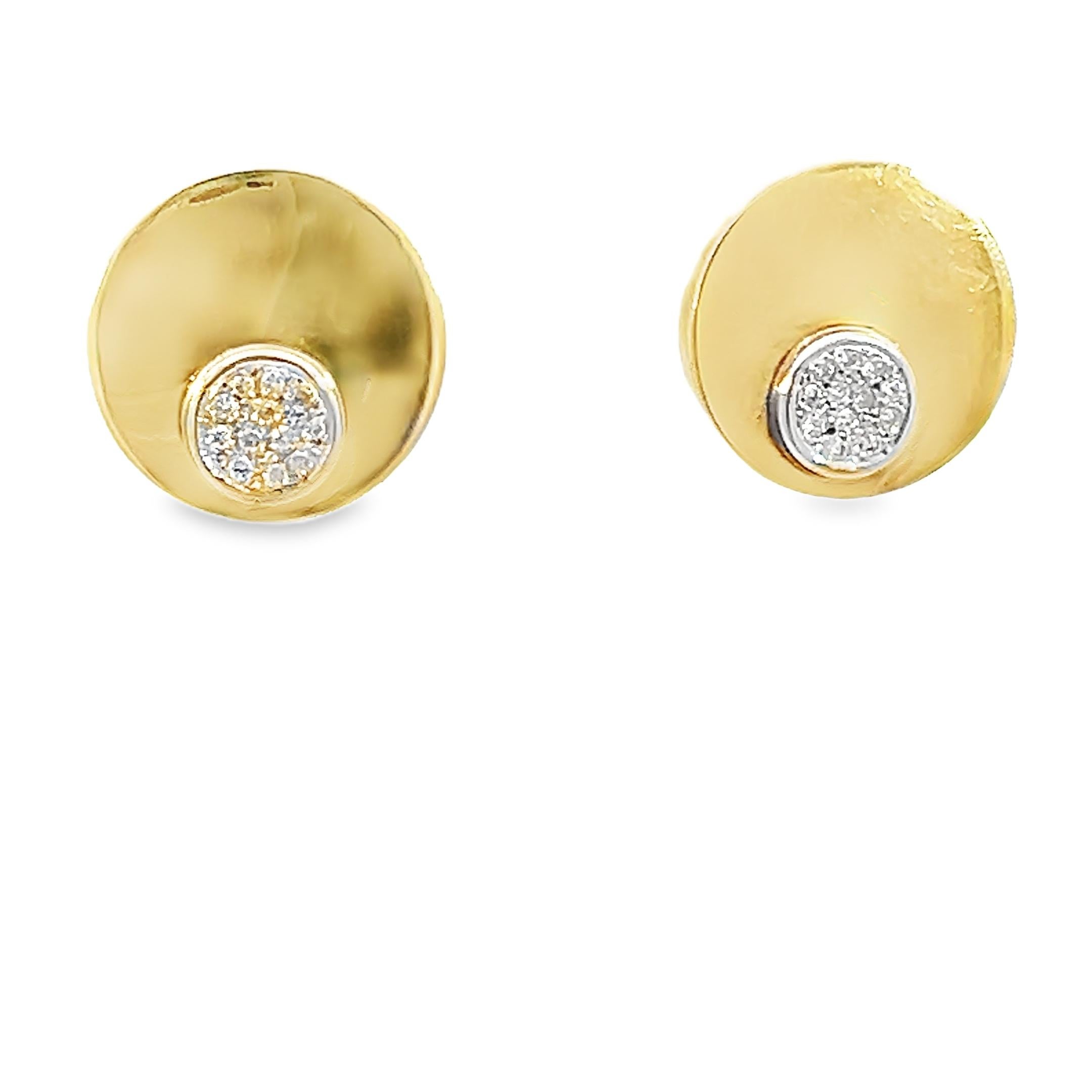 These elegant 18K white and yellow gold retro disc lever-back diamond earrings feature a polished gold disc accented by a bezel-set cluster of round brilliant diamonds. Crafted from rich 18 karat gold and stamped 18K, the earrings measure 1 inch x 1