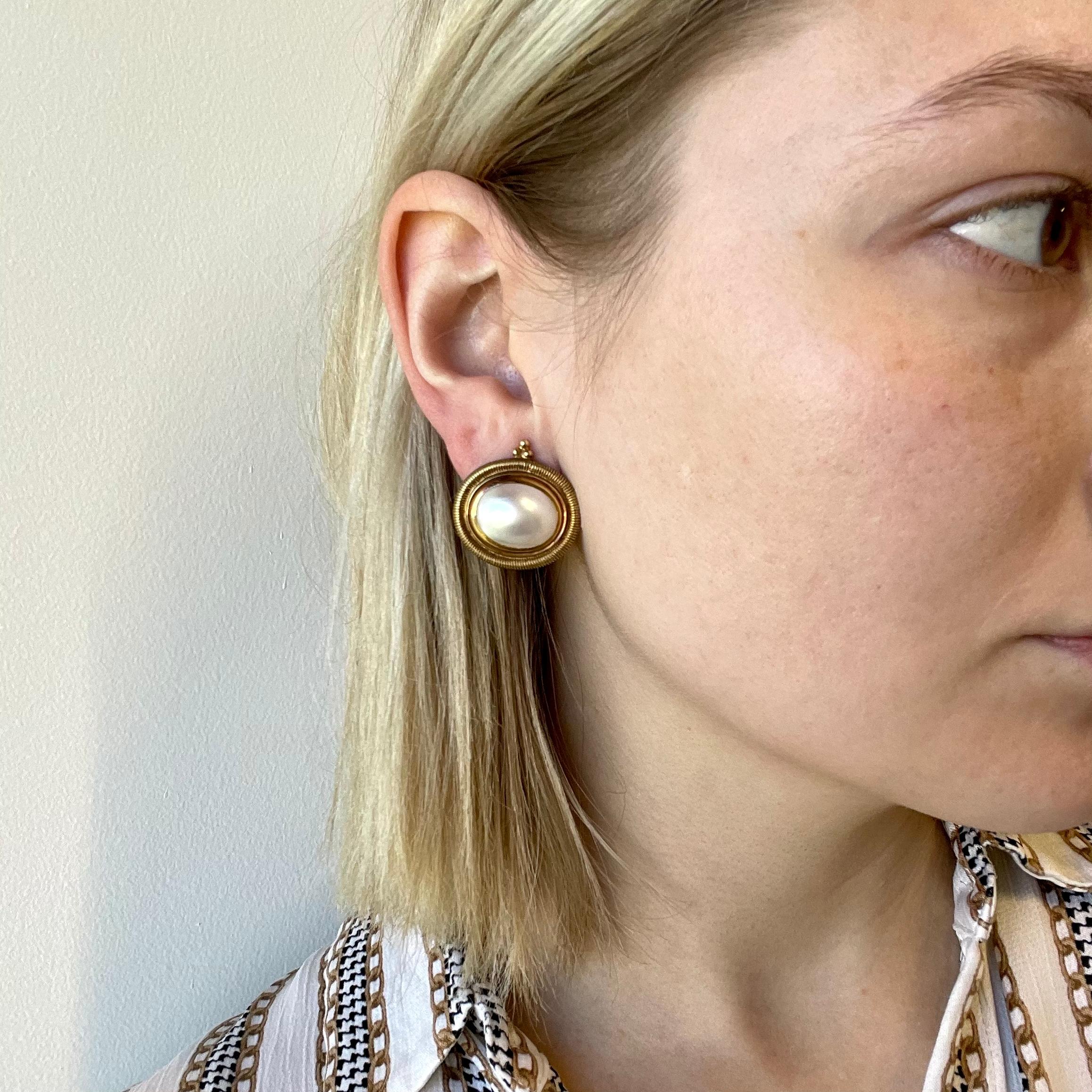 Yellow gold and pearl jewelry is a very trendy and desirable style that fashion icons are on the hunt for. These Retro Elizabeth Gage 18 K Gold Ear Clips, can be the perfect addition to your vintage jewelry collection. 

Mother of pearl, signed