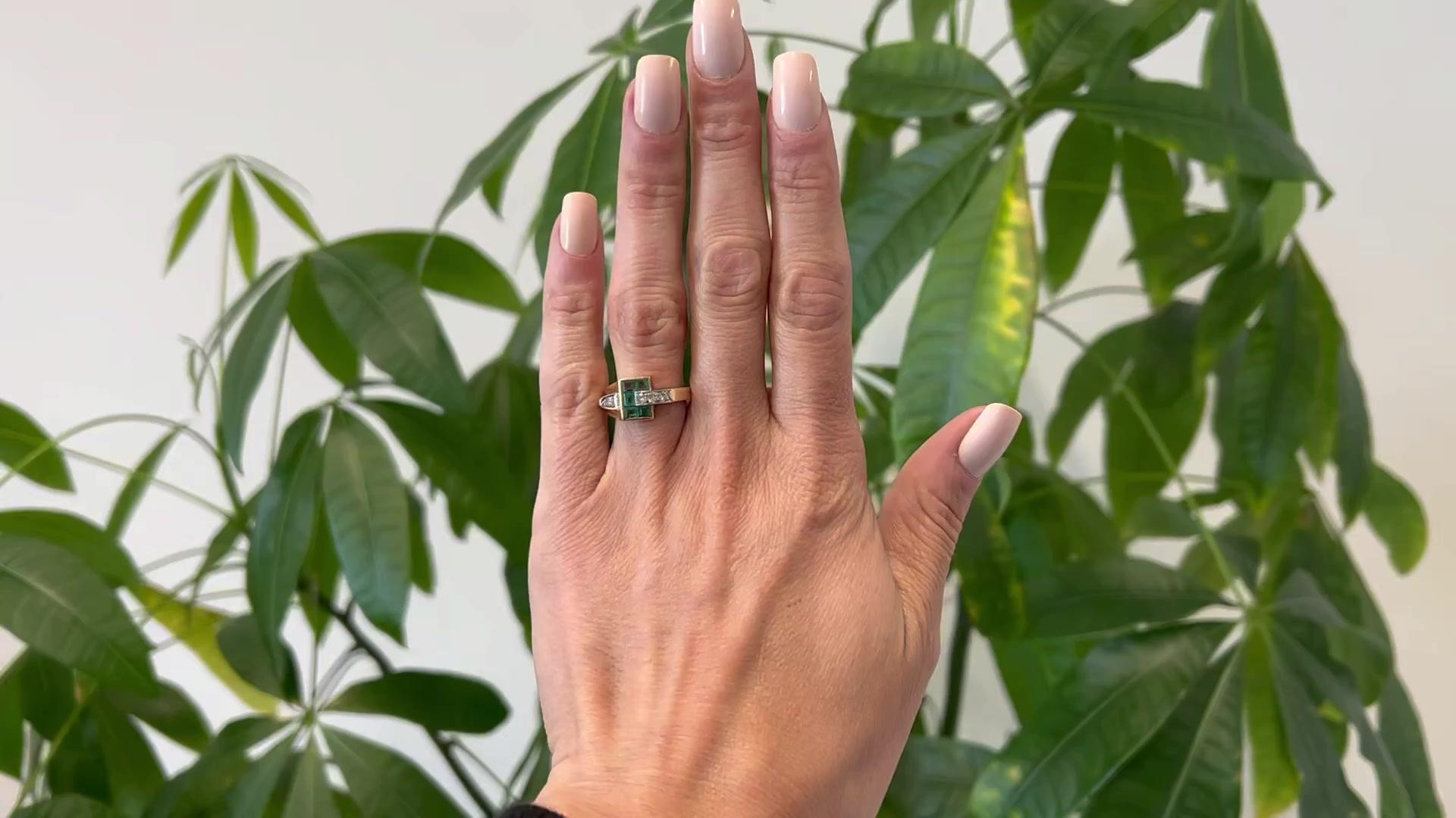 One Retro Emerald and Diamond 14k Yellow Gold Platinum Tank Ring. Featuring five square step cut emeralds with a total weight of approximately 0.55 carat. Accented by four round brilliant cut diamonds with a total weight of approximately 0.20 carat,