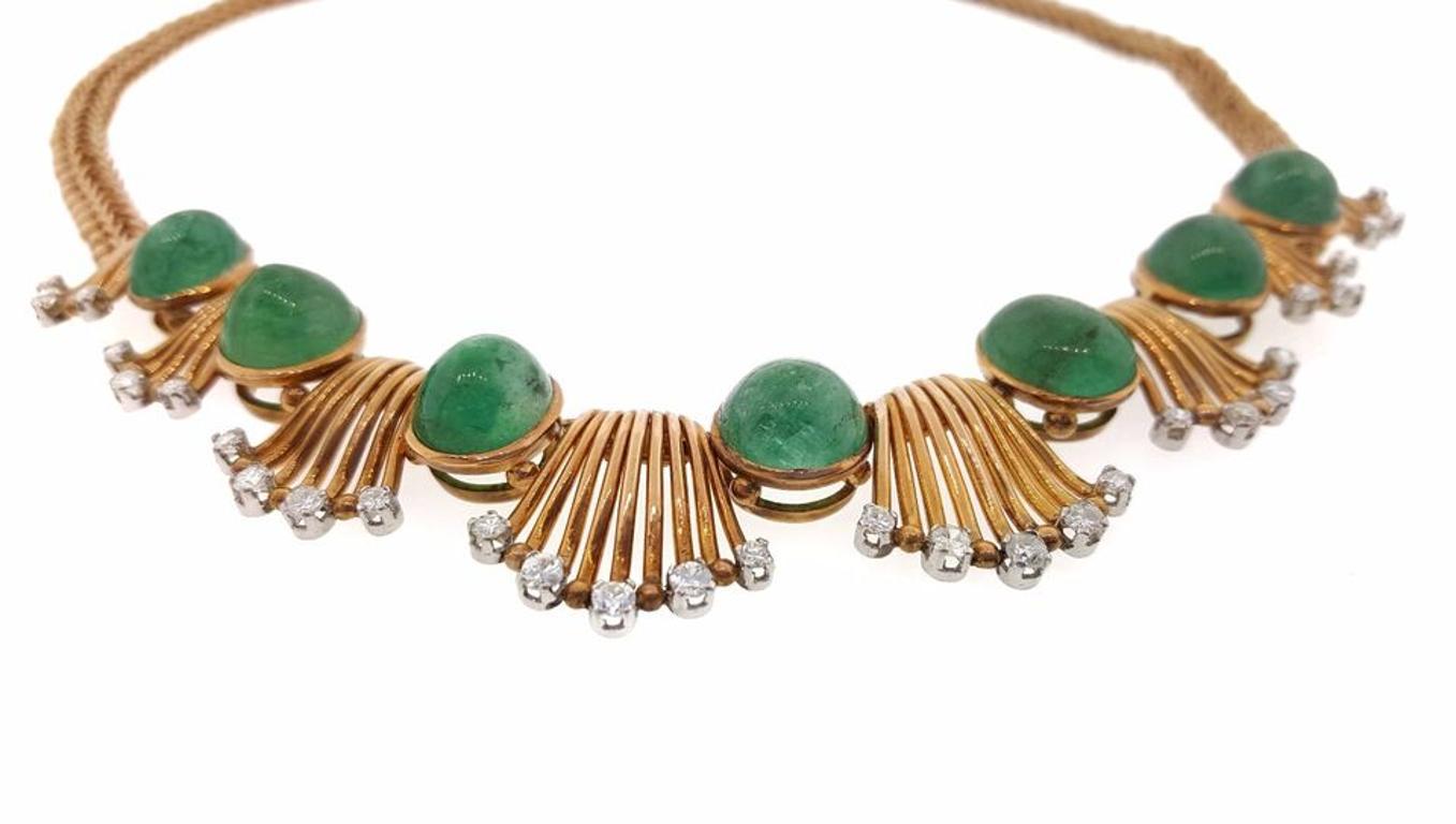 Vintage Retro Emerald Cabochon and Diamond Necklace 18K Rose Gold

Retro Emerald Cabochon and Diamond Necklace features 7 bezel set Emerald cabochons, collectively weighing over 25 carats approximately, accented by 8 scalloped links in high polished