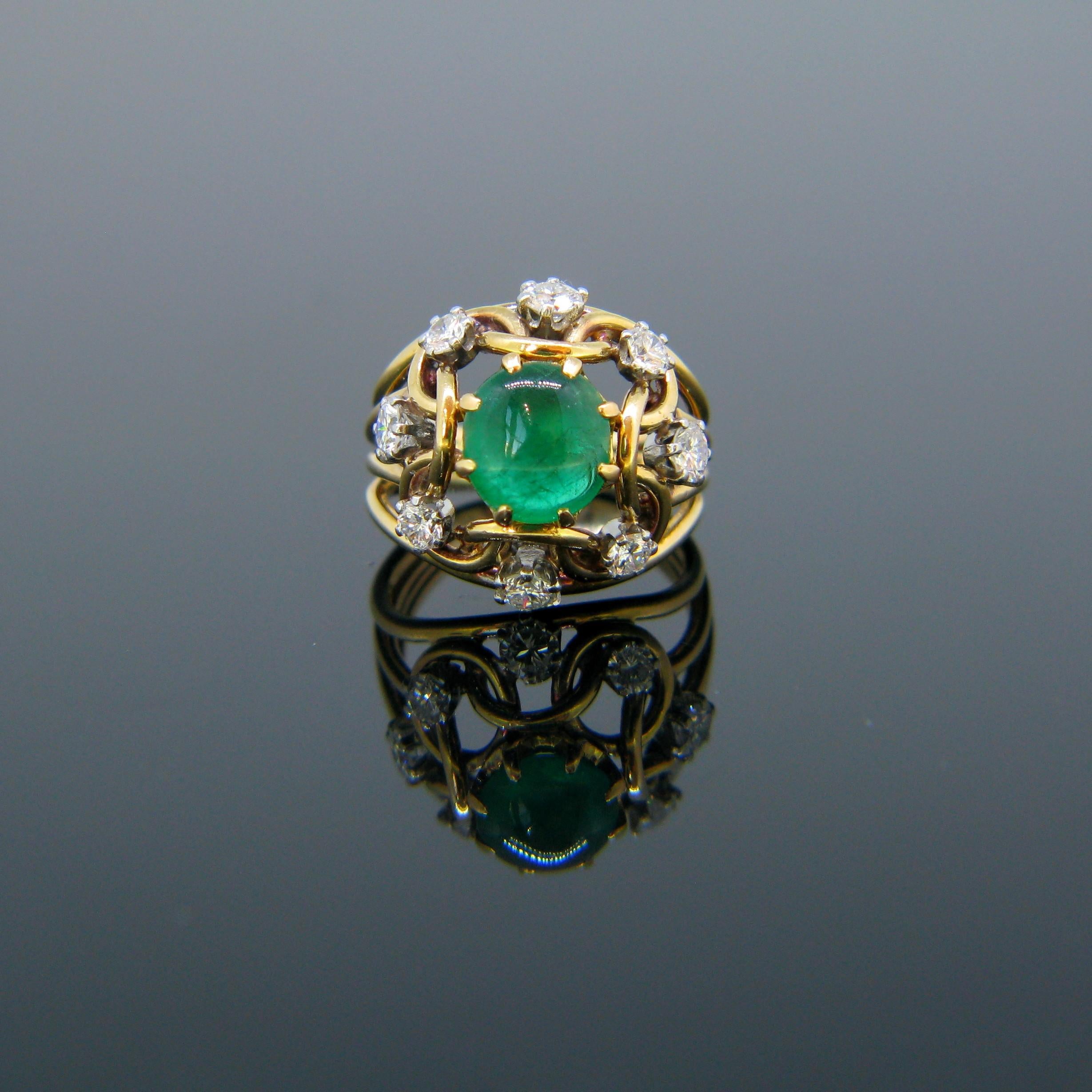 Weight:	7.8gr

Metal:	18kt Yellow Gold (tested)
	Platinum (tested)

Stones:	1 Emerald
•	Cut:	Cabochon
•	Carat weight:	1.5ct

Others:	8 Diamonds
•	Cut	Round Brilliant
•	Total carat Weight:	0.8ct